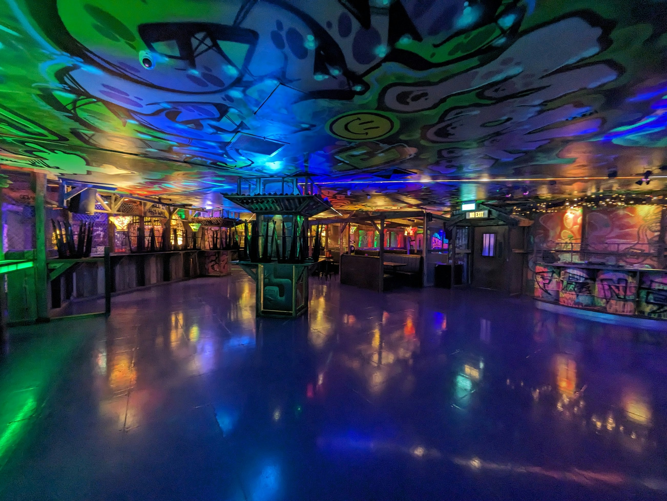 Empty nightclub floor with colourful lit ceiling