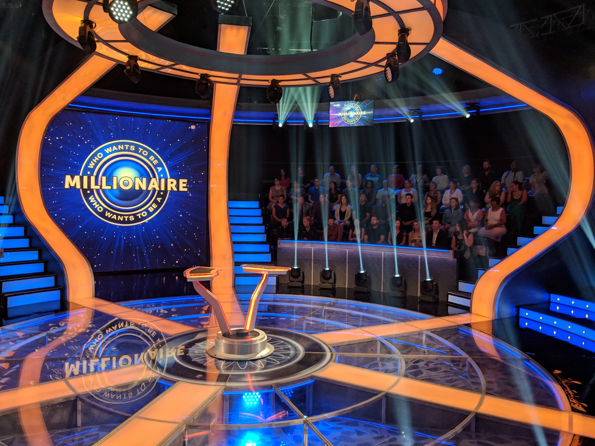 The Who Wants to Be a Millionaire game show set with audience seating