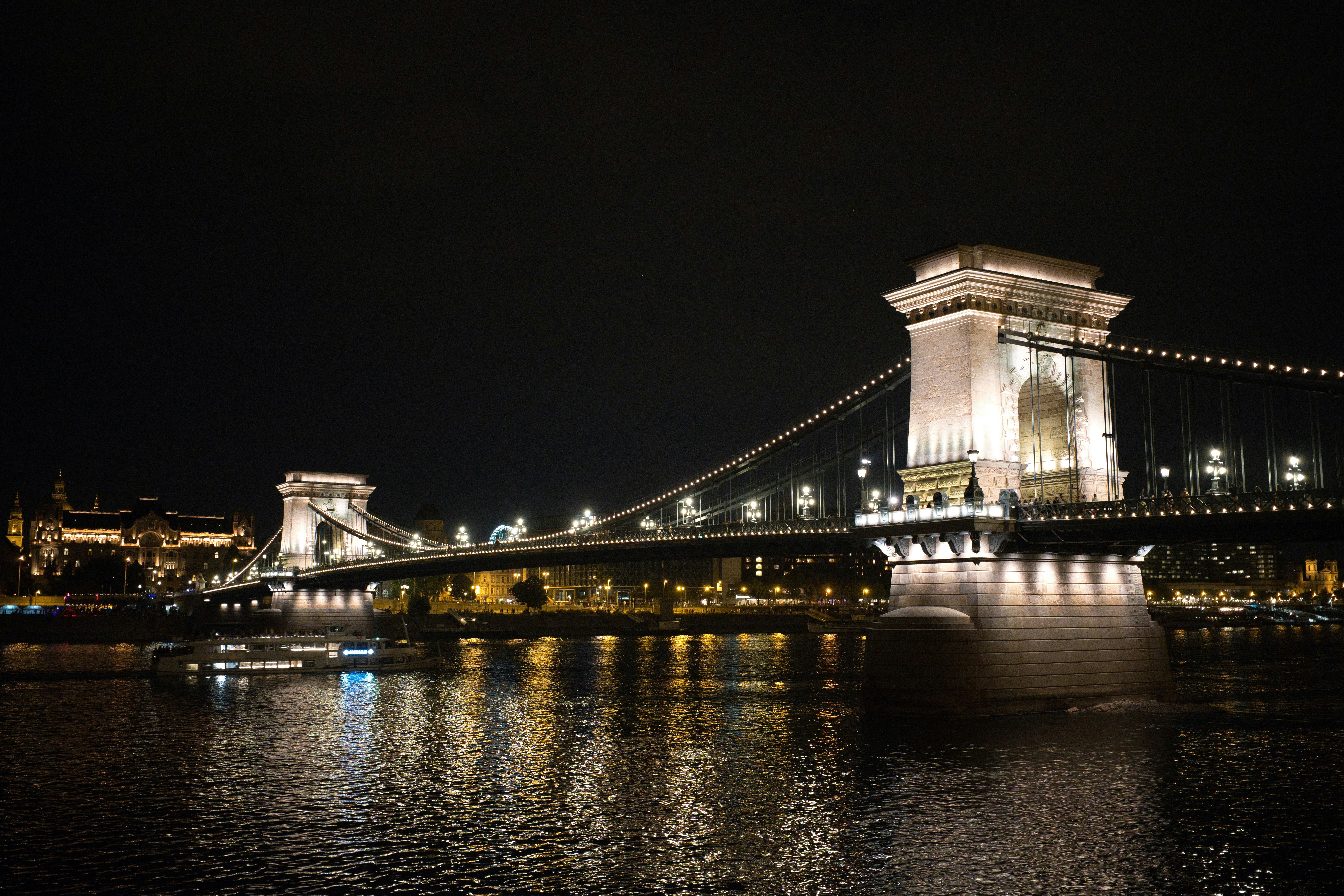 The illuminated Széchenyi Chain Bridge over the Danube river in Budapest at night