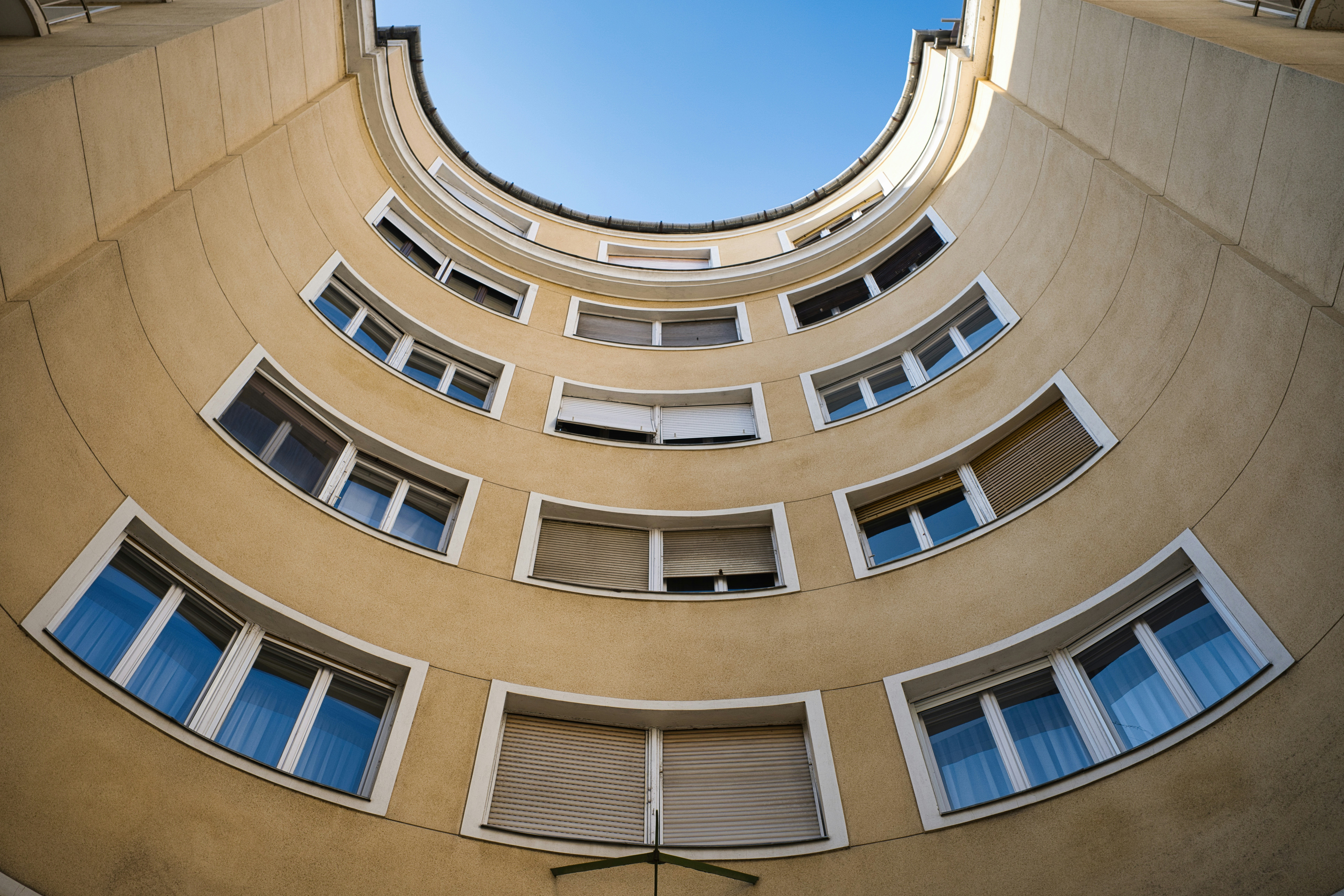 Curved yellow apartment facade