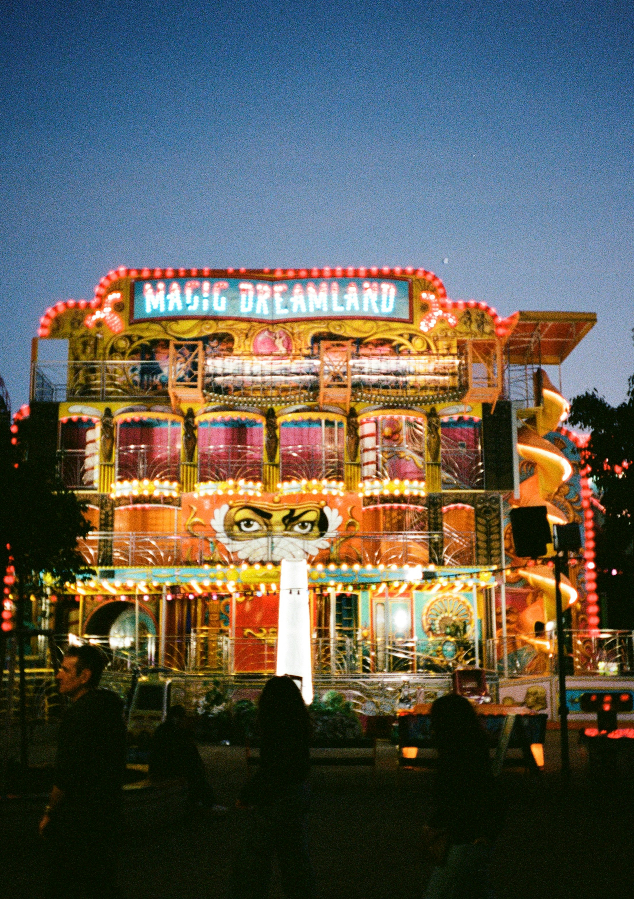 The Magic Dreamland funhouse with glowing neon lights at night in Vienna