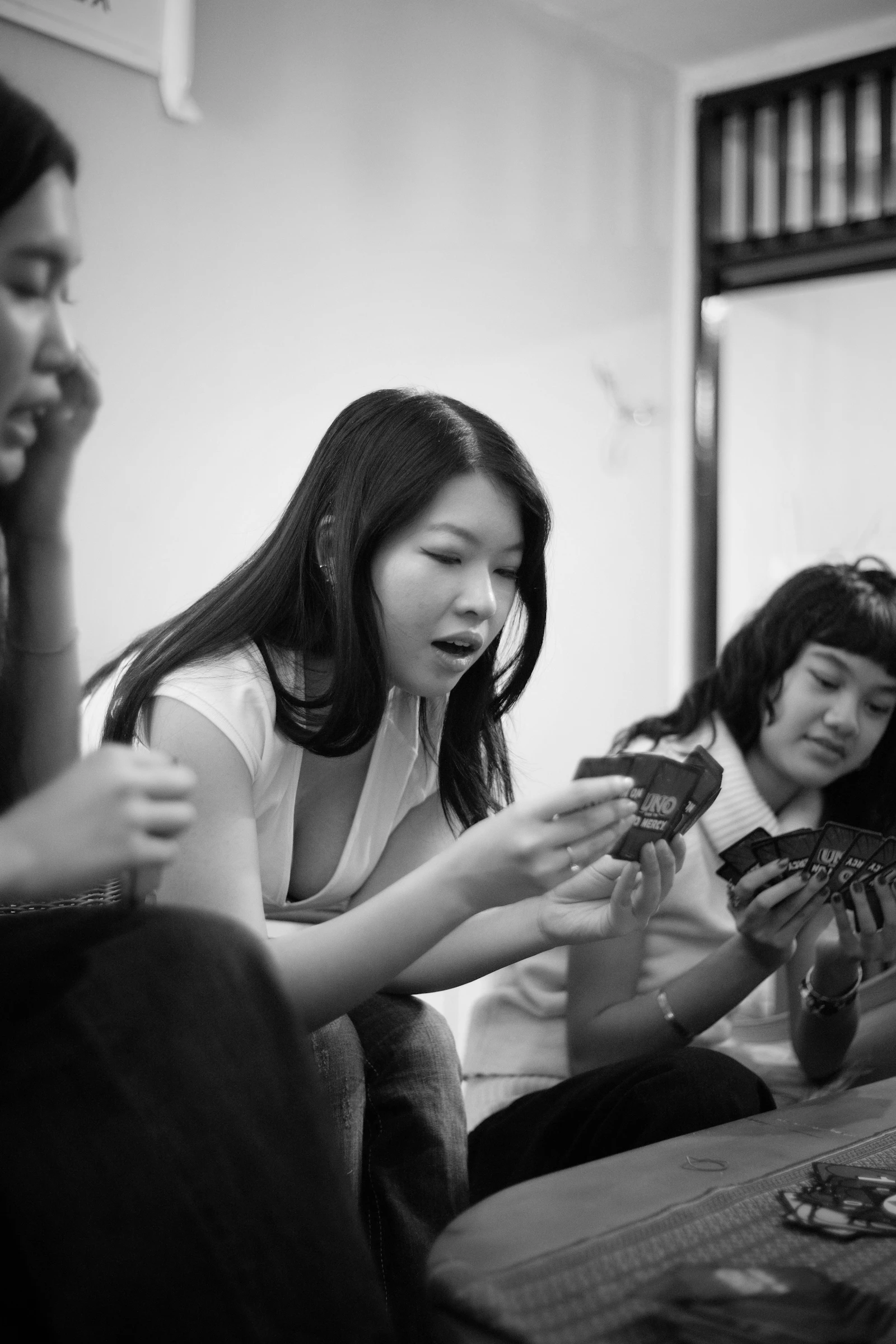 Friends gathered around a table for a lively card game