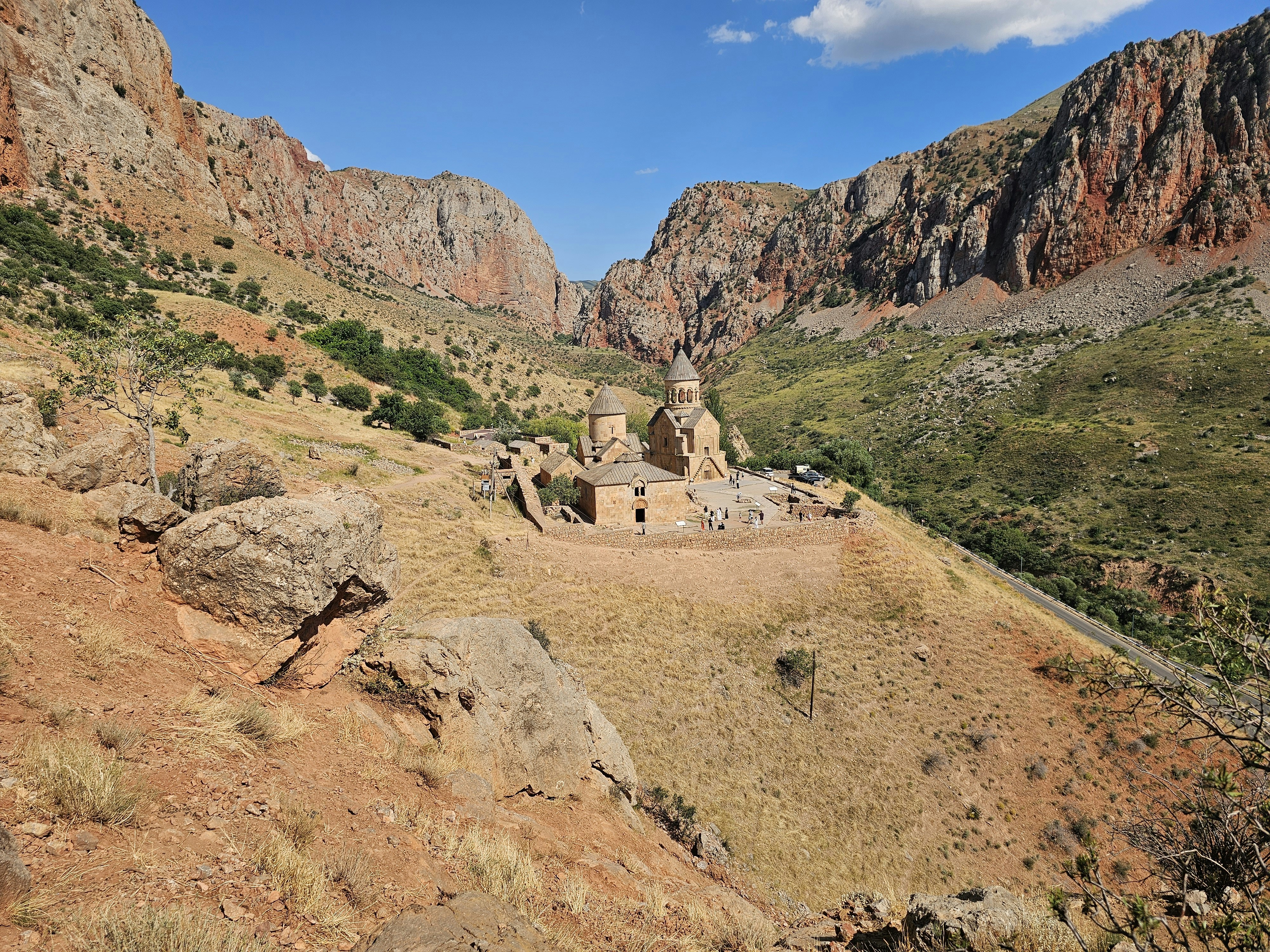 Noravank Monastery nestled in a deep canyon with red rock cliffs in Armenia