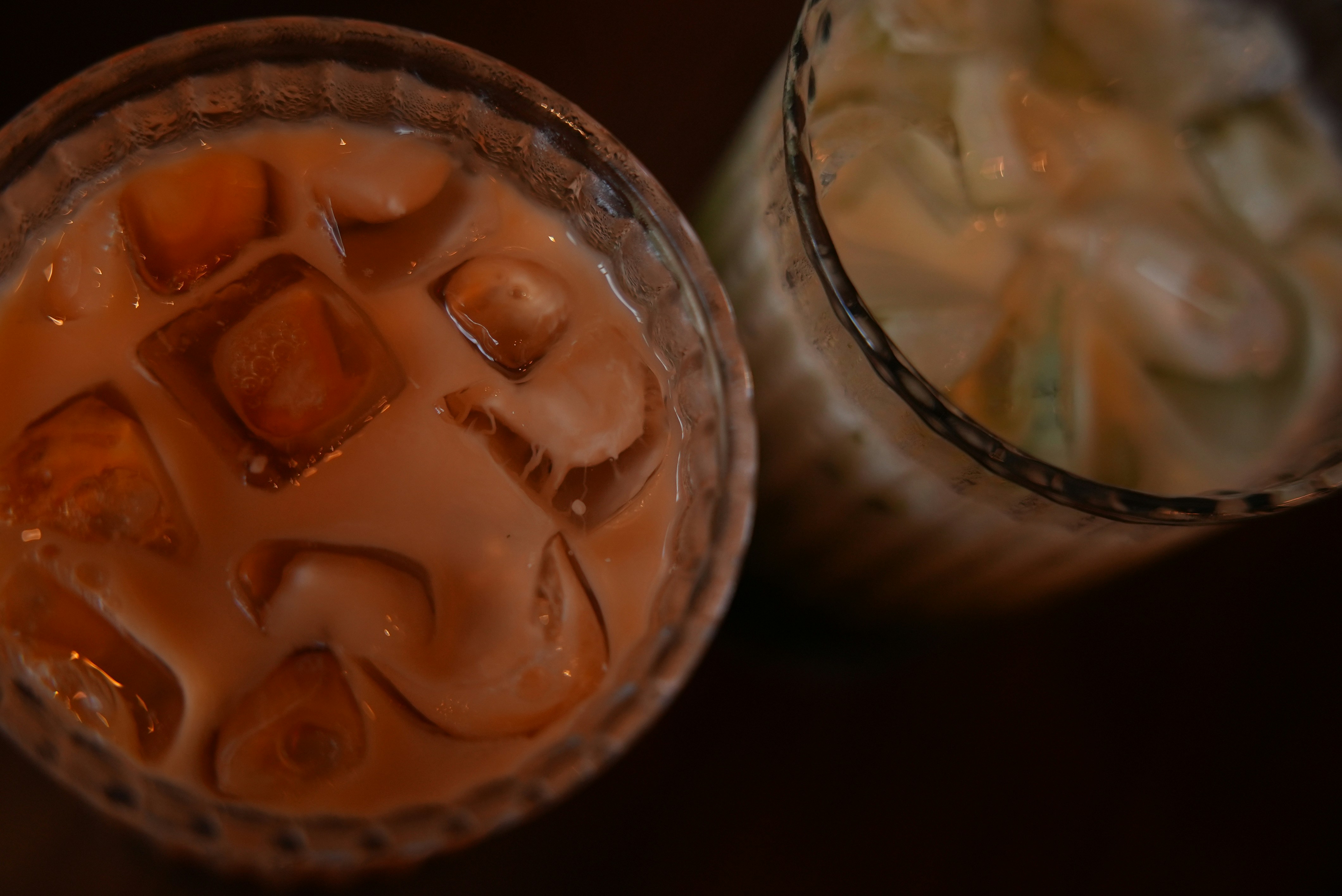 Two glasses of iced coffee with milk