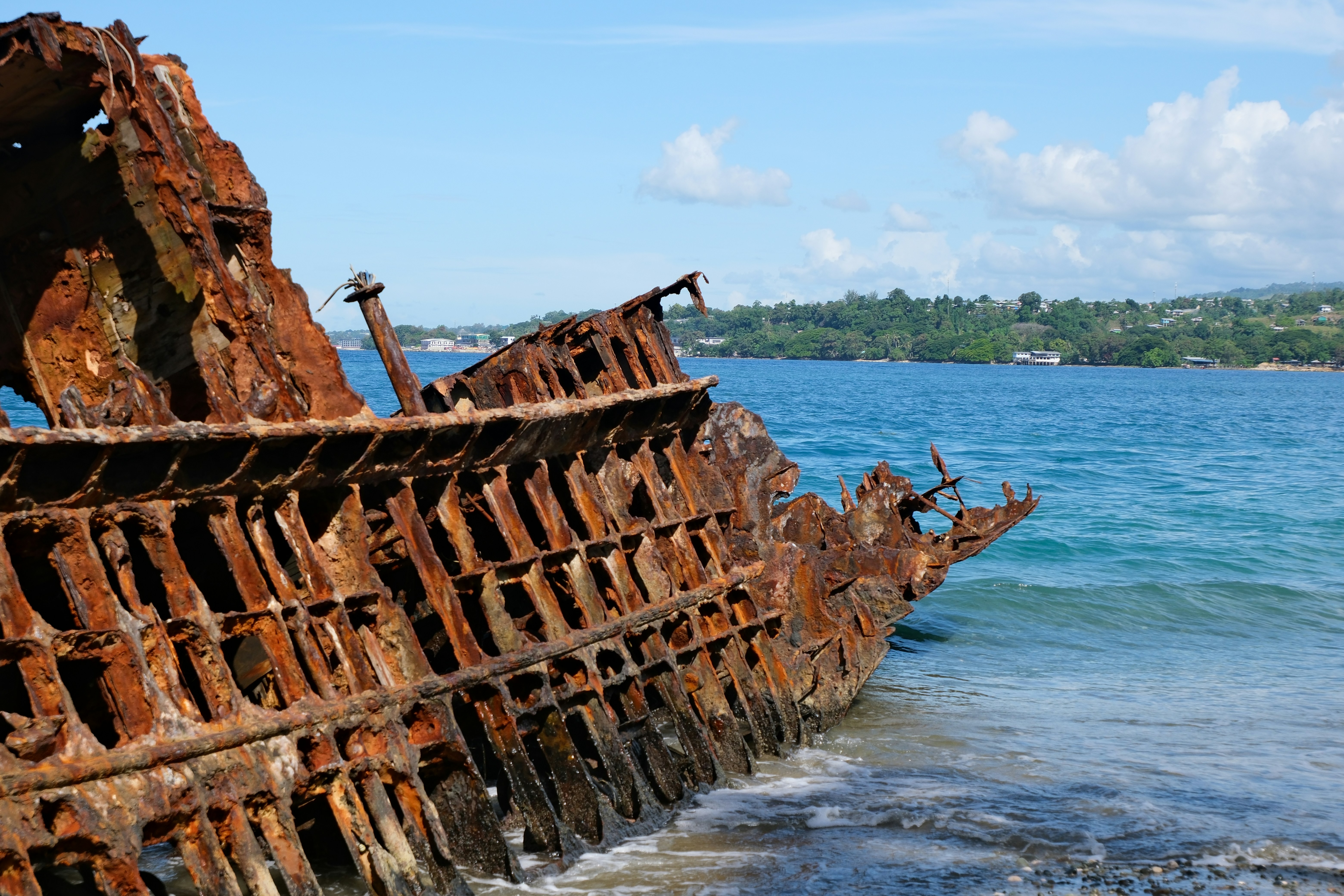 Nyang Nyang Beach & Coastal Wilderness — The iconic weathered vessel shipwreck remnants resting half-buried in the golden-white sand dunes.