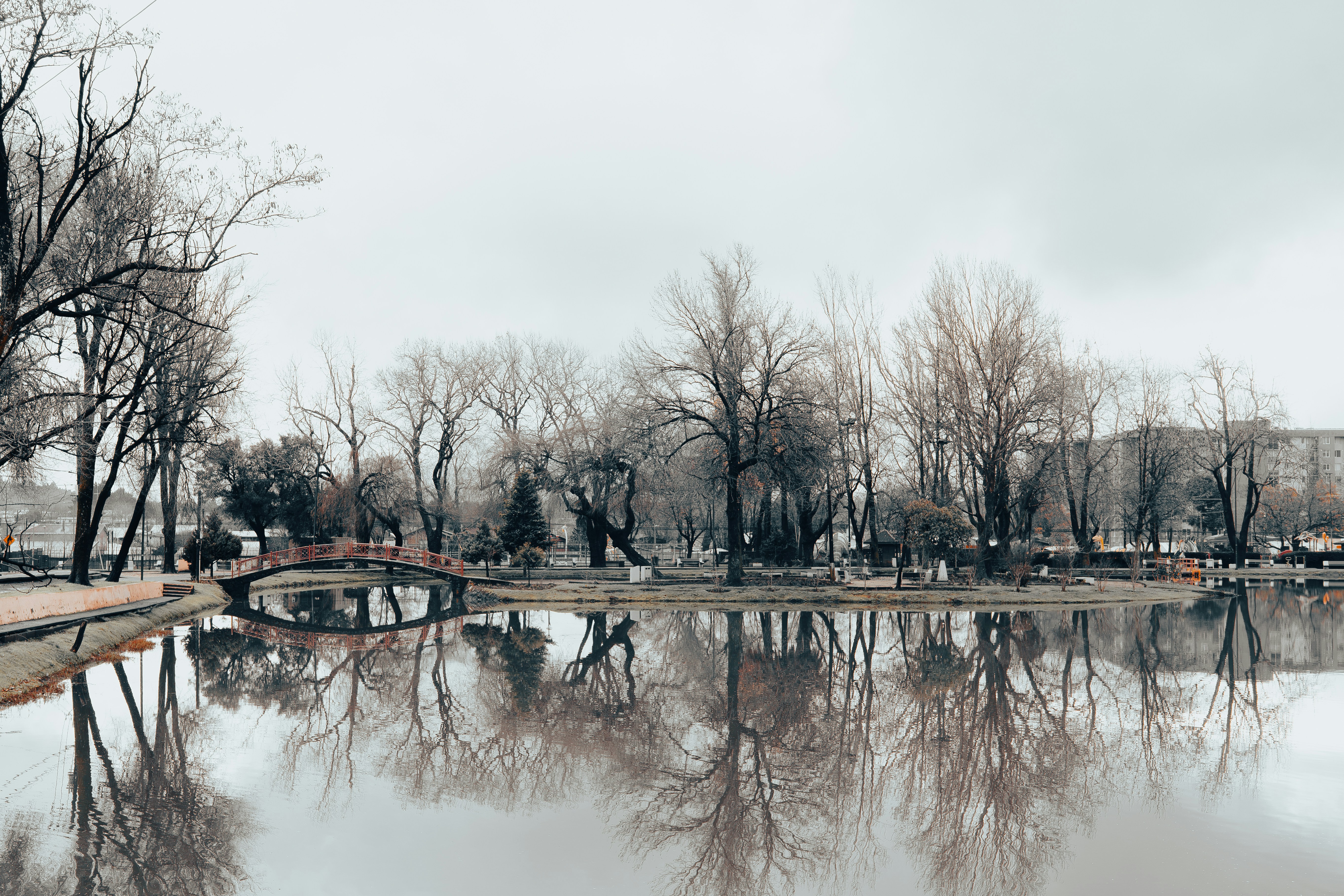 Red arched bridge over lake - Free Photo on Unsplash