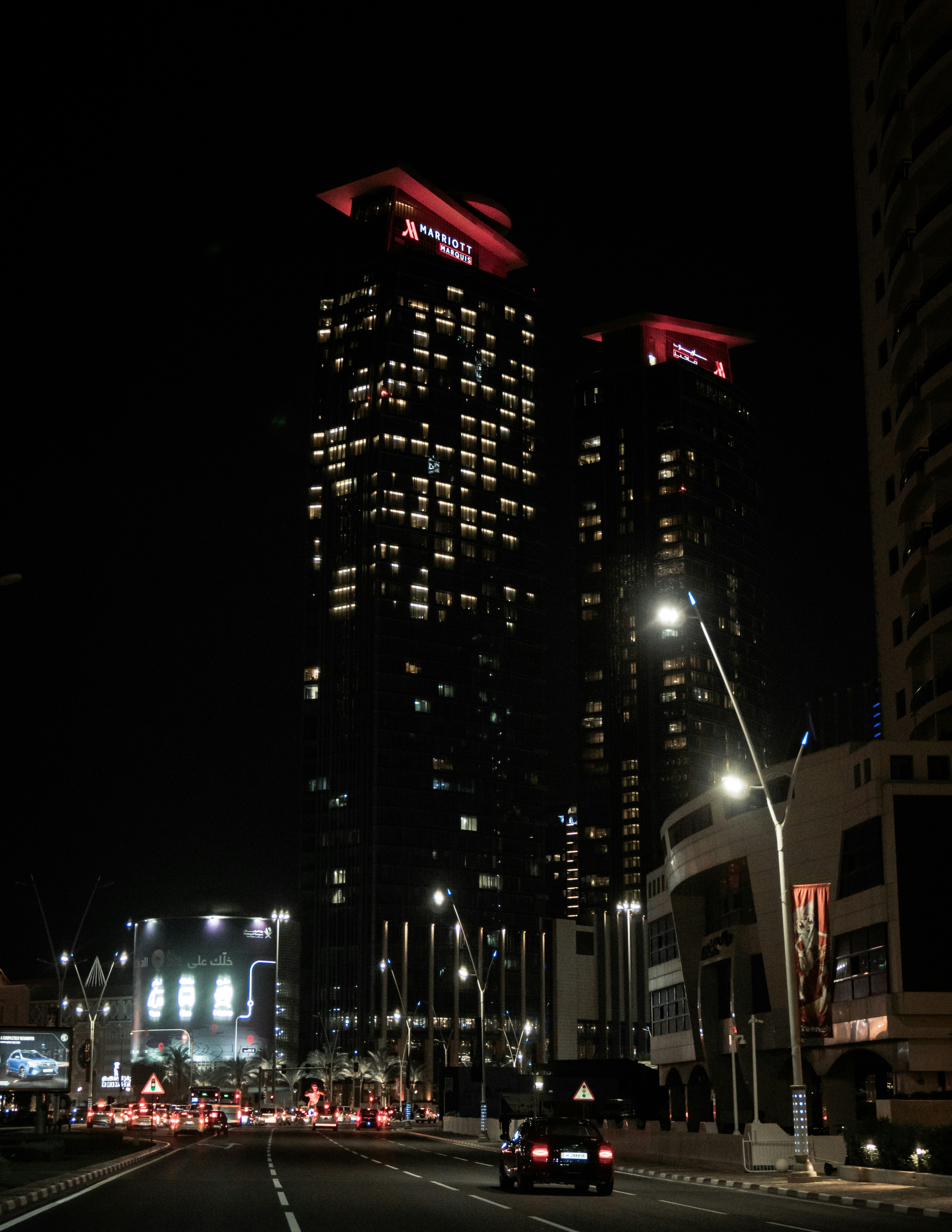 The Marriott Marquis hotel towers lit up at night with illuminated signage &mdash; Marriott Bonvoy's up to 4,500 bonus points fall 2026 promotion