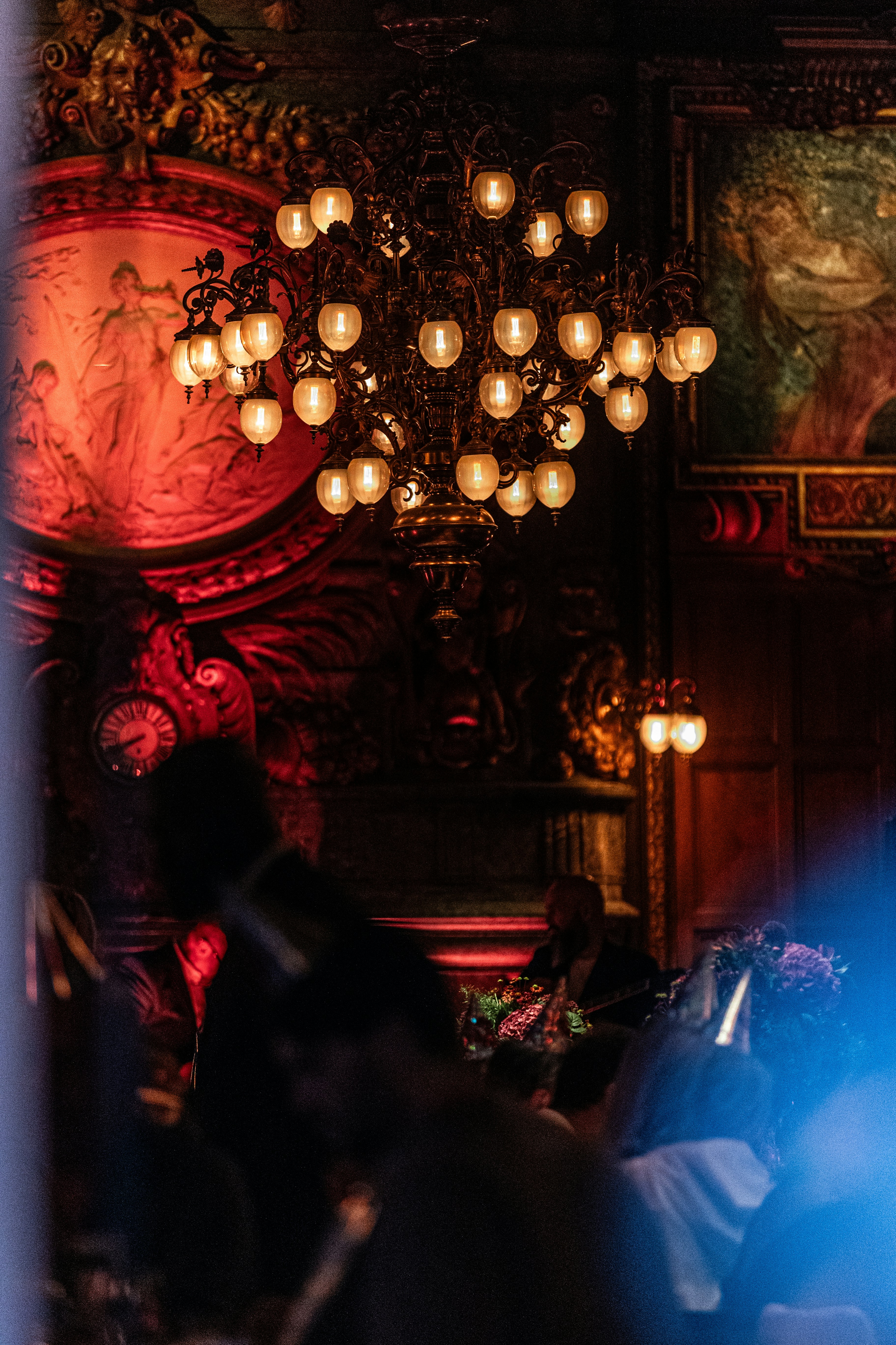 Ornate chandelier in dimly lit room - Free Photo on Unsplash