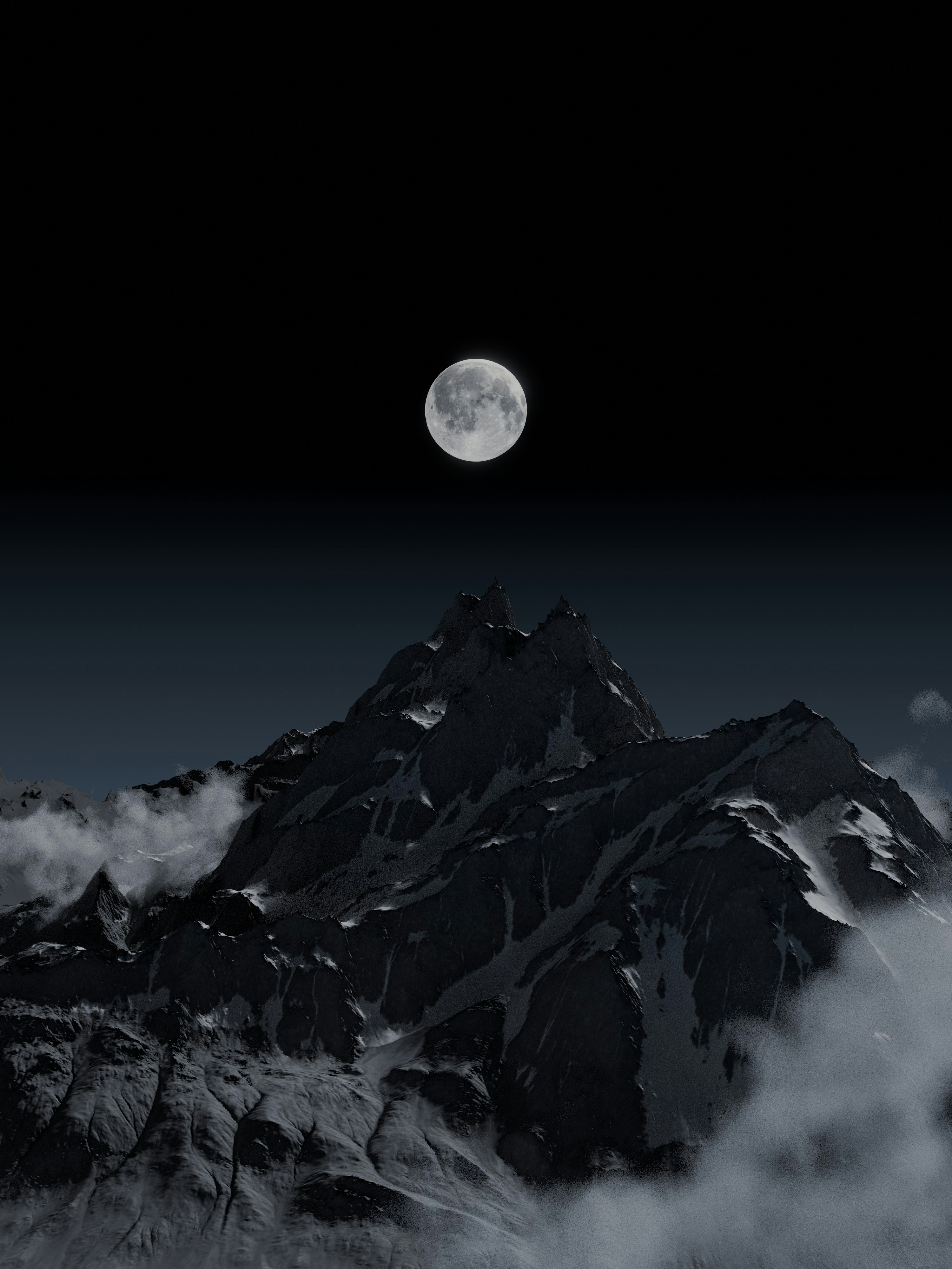 A full moon above a dark, snow-capped mountain peak surrounded by clouds