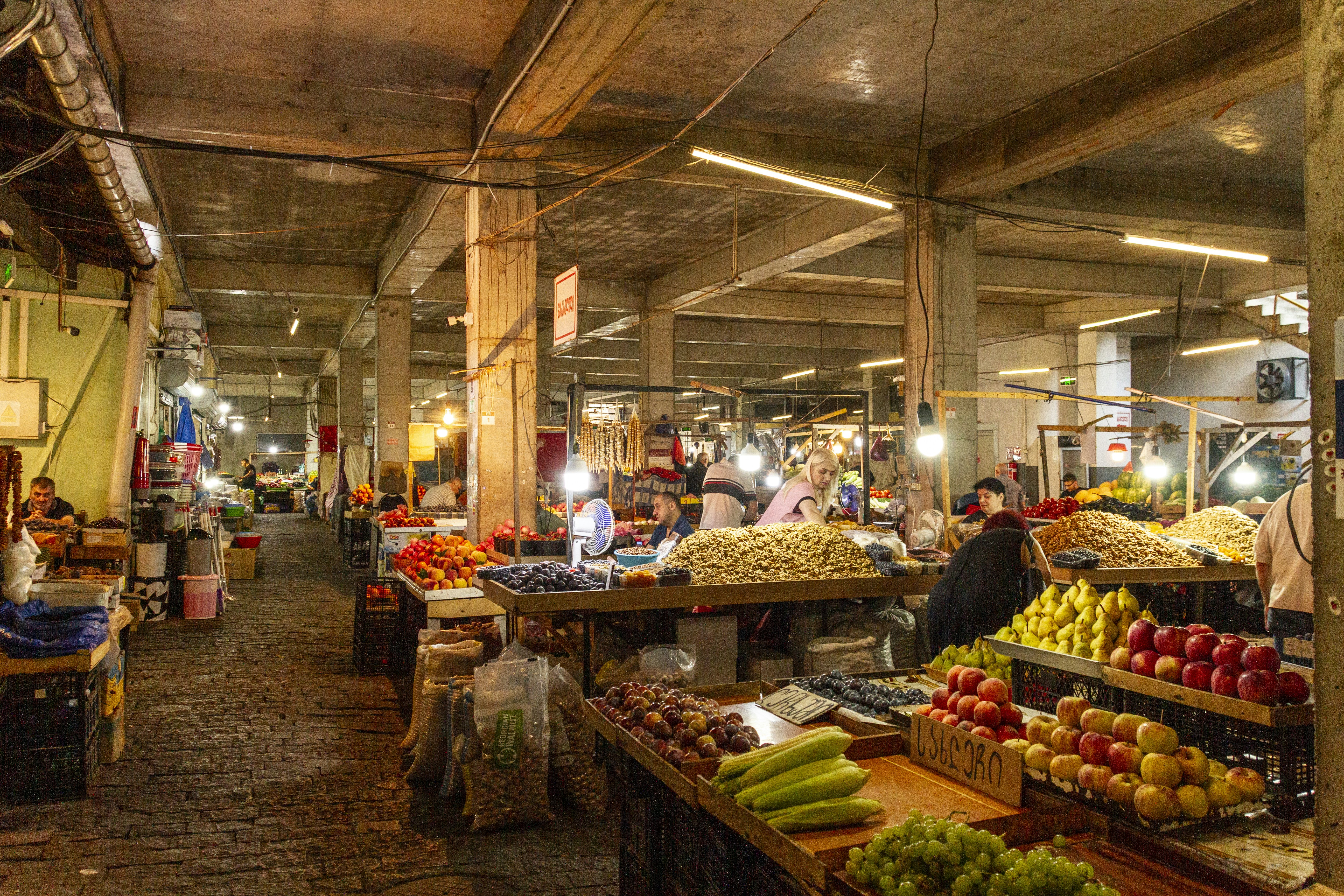 People shopping in a covered market hall