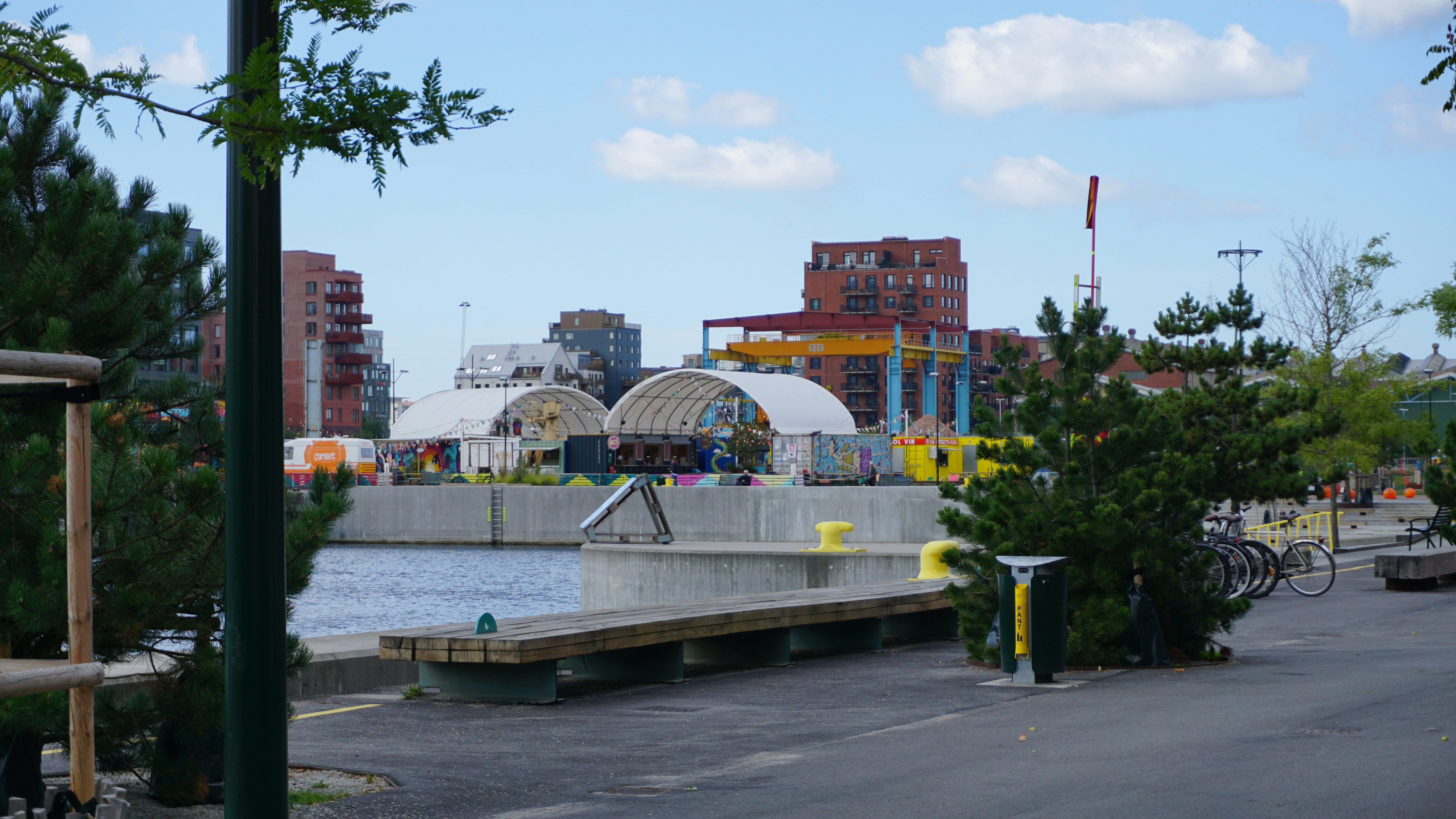 Waterfront park with colorful event structures - Free Photo on Unsplash