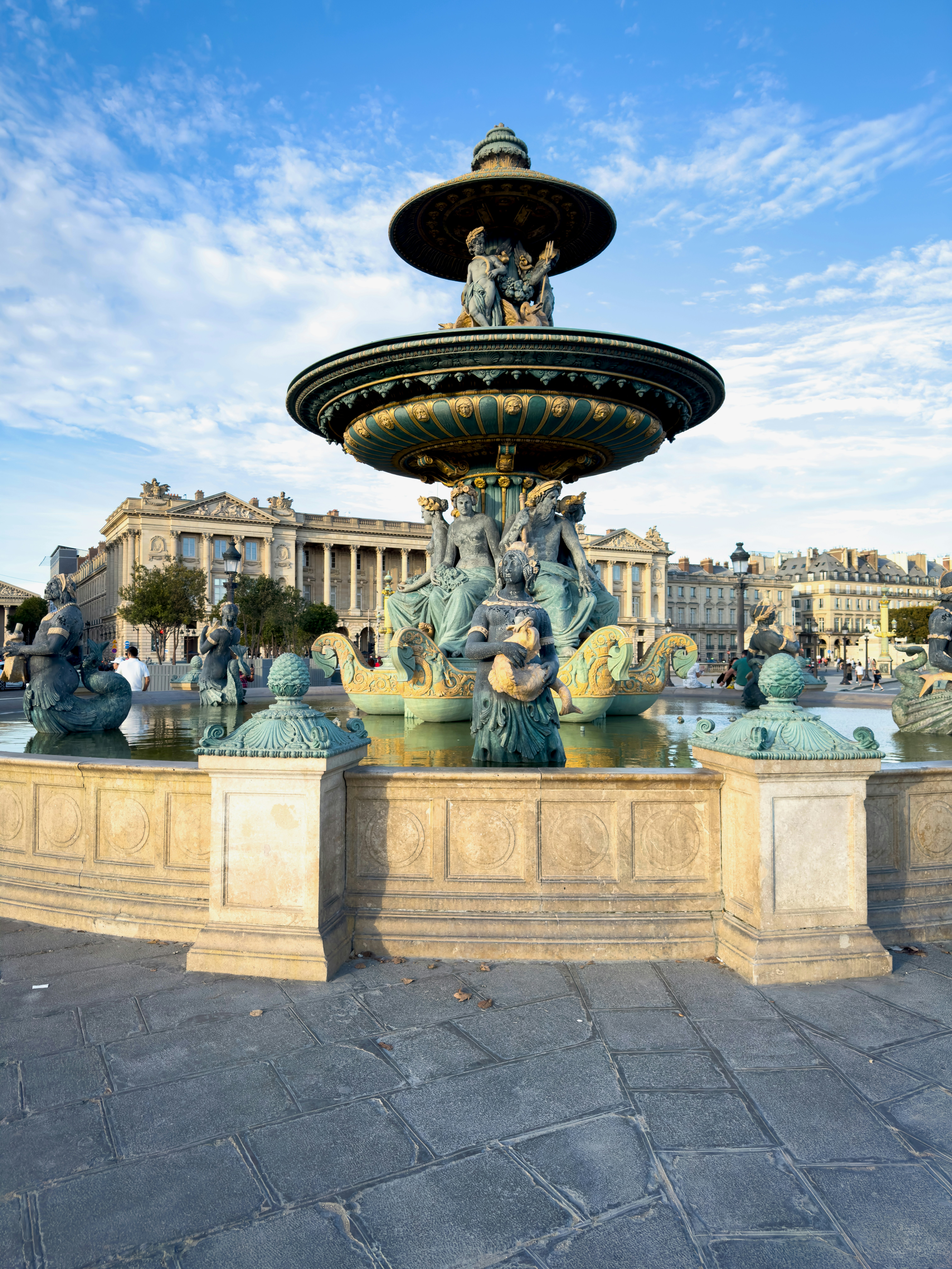 The Fontaine des Fleuves in Place de la Concorde, Paris, under a blue sky