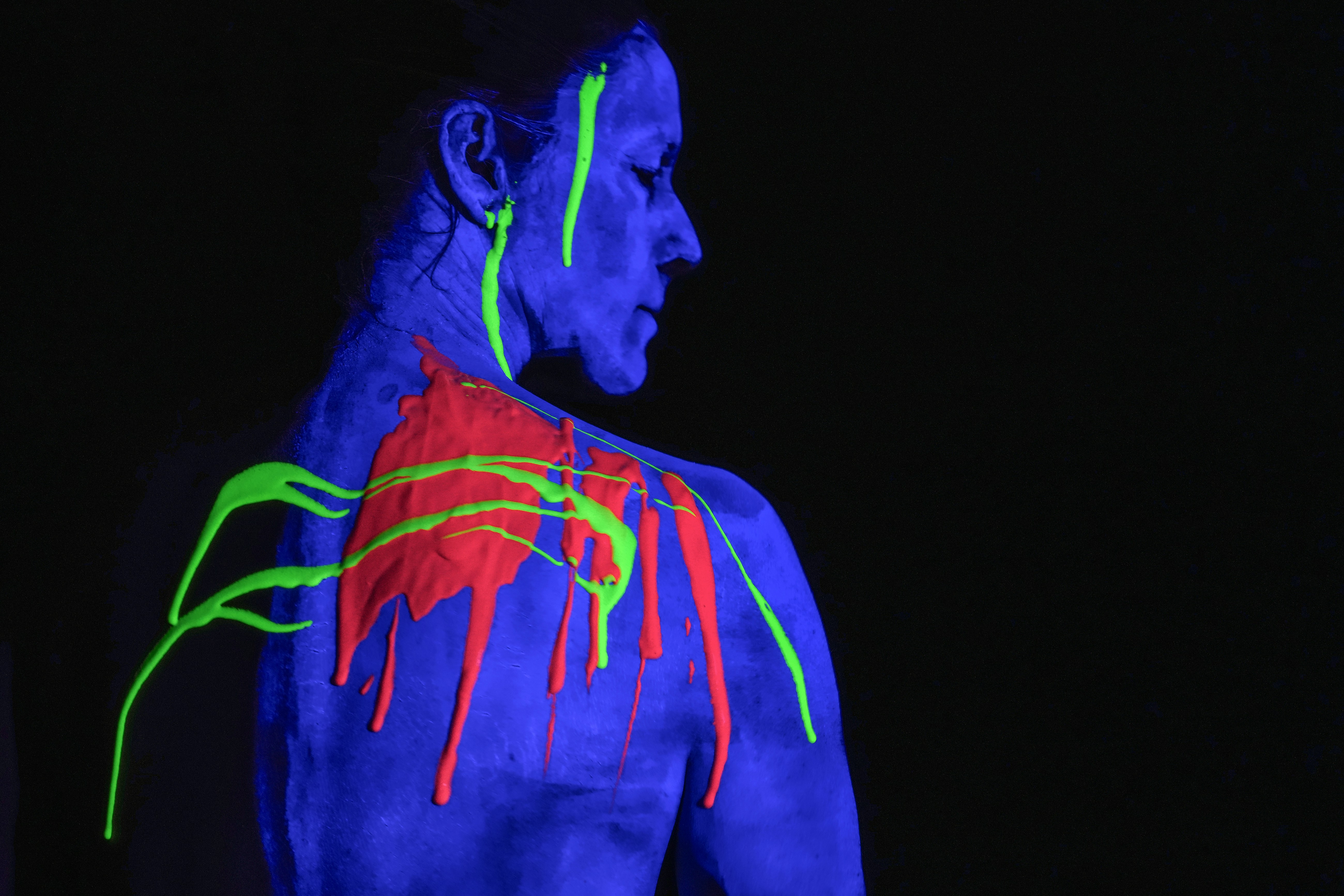 protective suit covered in glowing neon paint