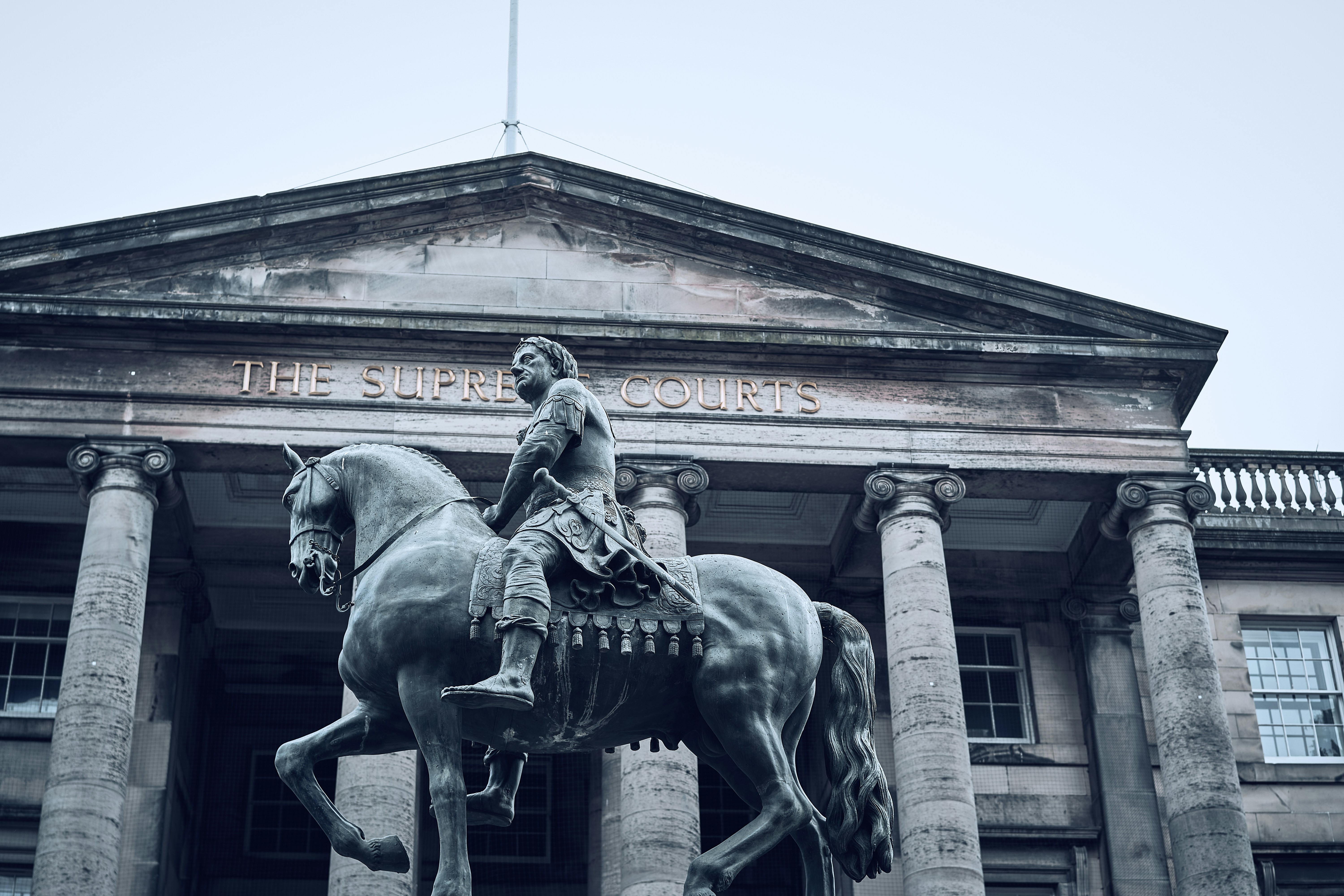 A monument and historic civic architecture in Edinburgh's Old Town.