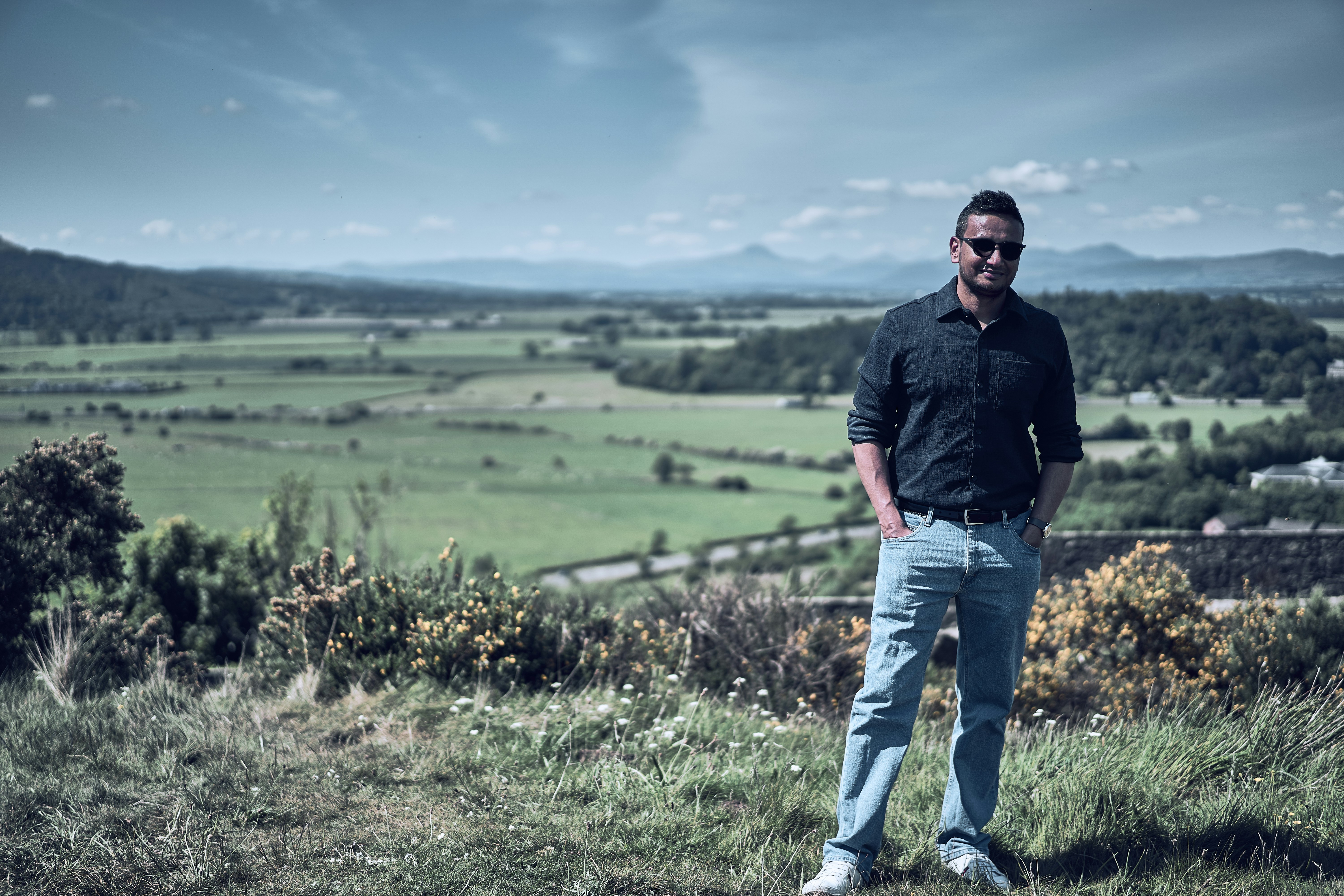 A portrait at the scenic overlook of Stirling Castle in Scotland.