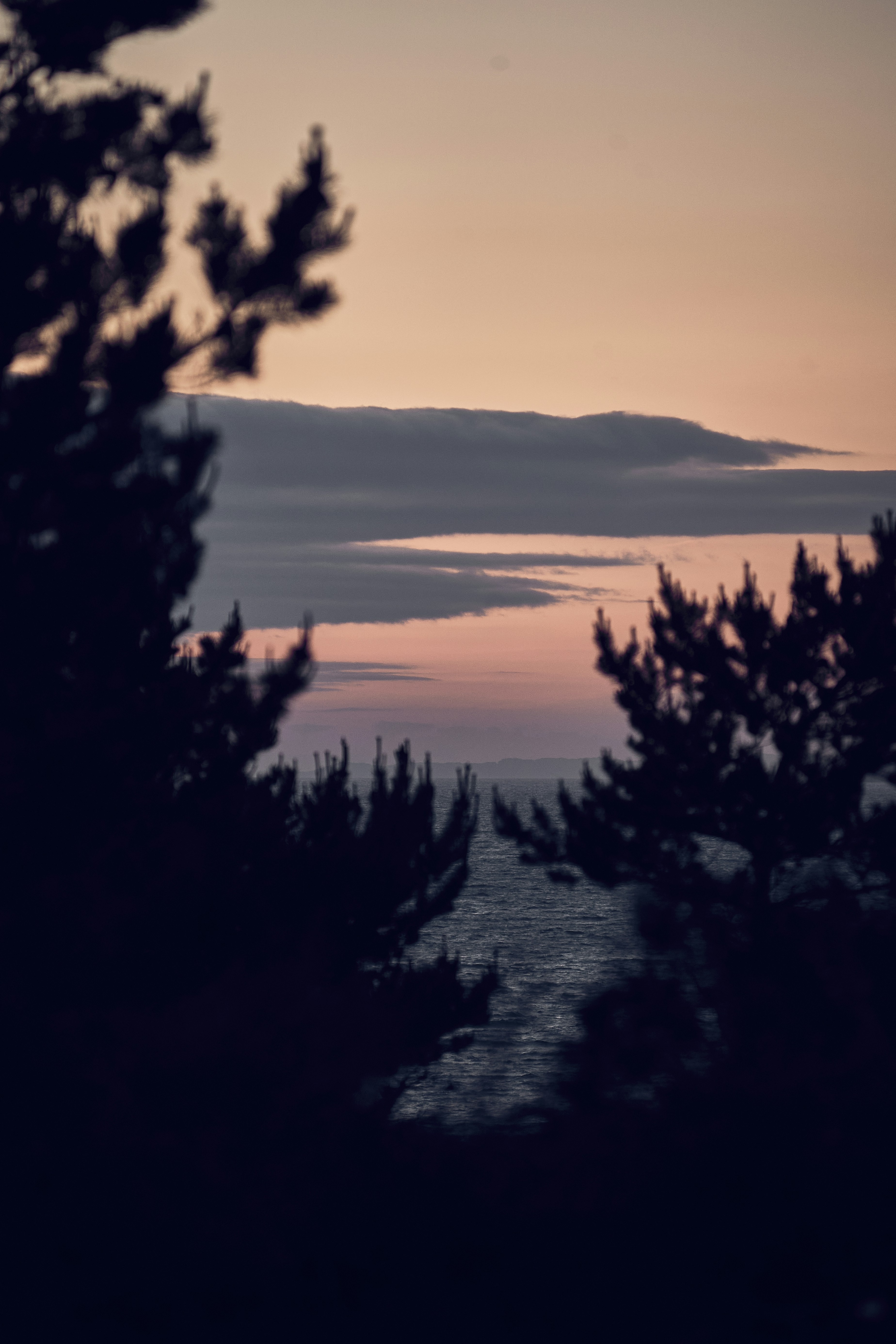 Evening light over the sea and hills of the Isle of Skye, Scotland.