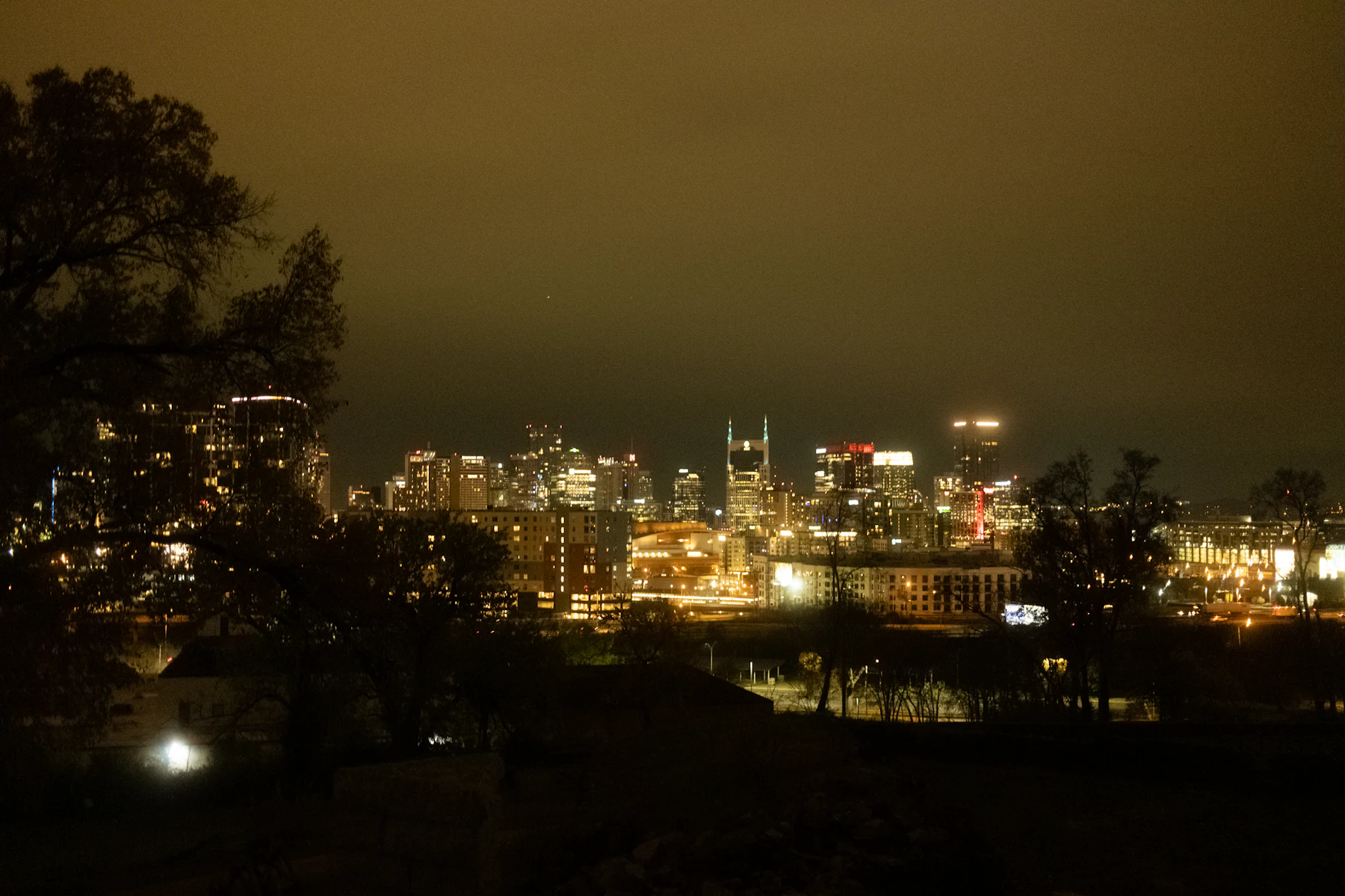 Nashville skyline at night under a cloudy sky