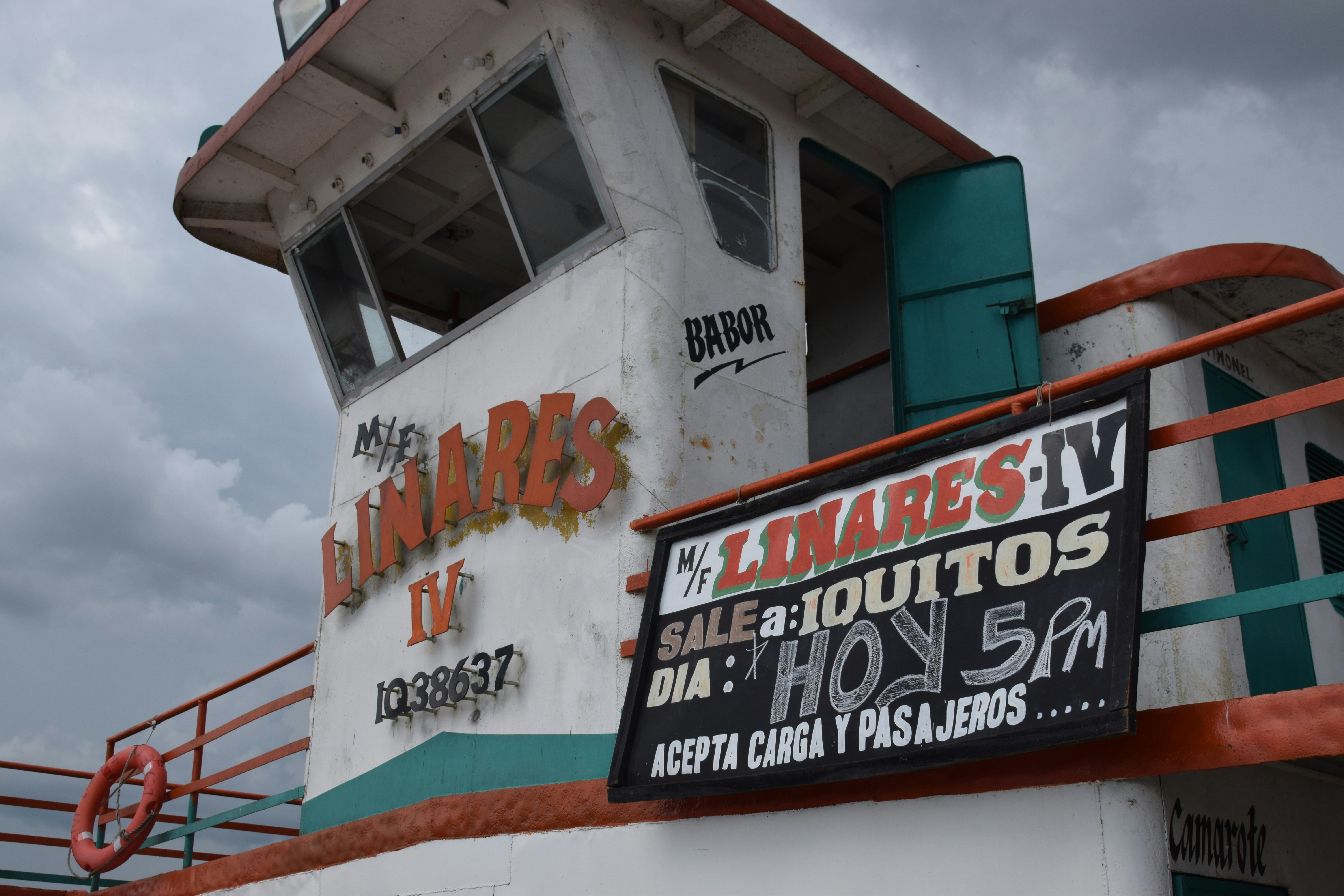The bridge of a river boat with a sign advertising travel to Iquitos