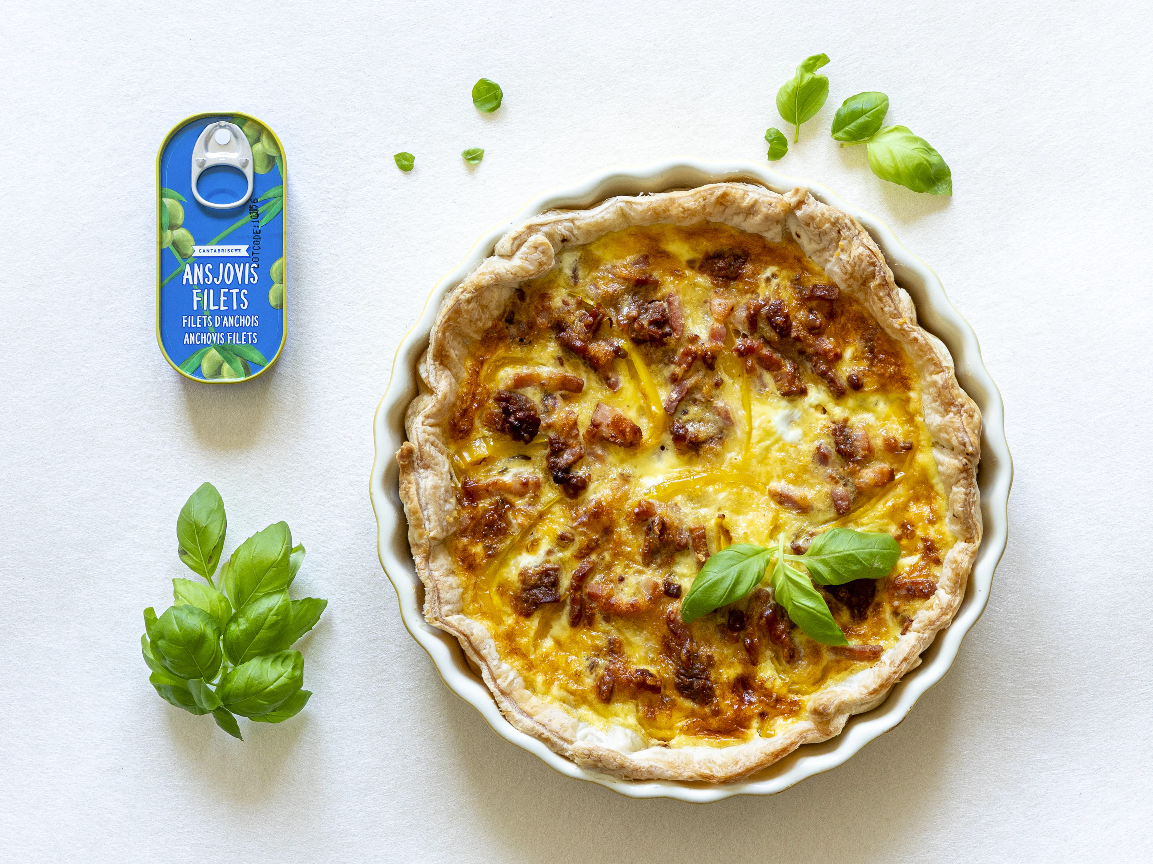 An Alsatian tart baked with bacon, onion and cream