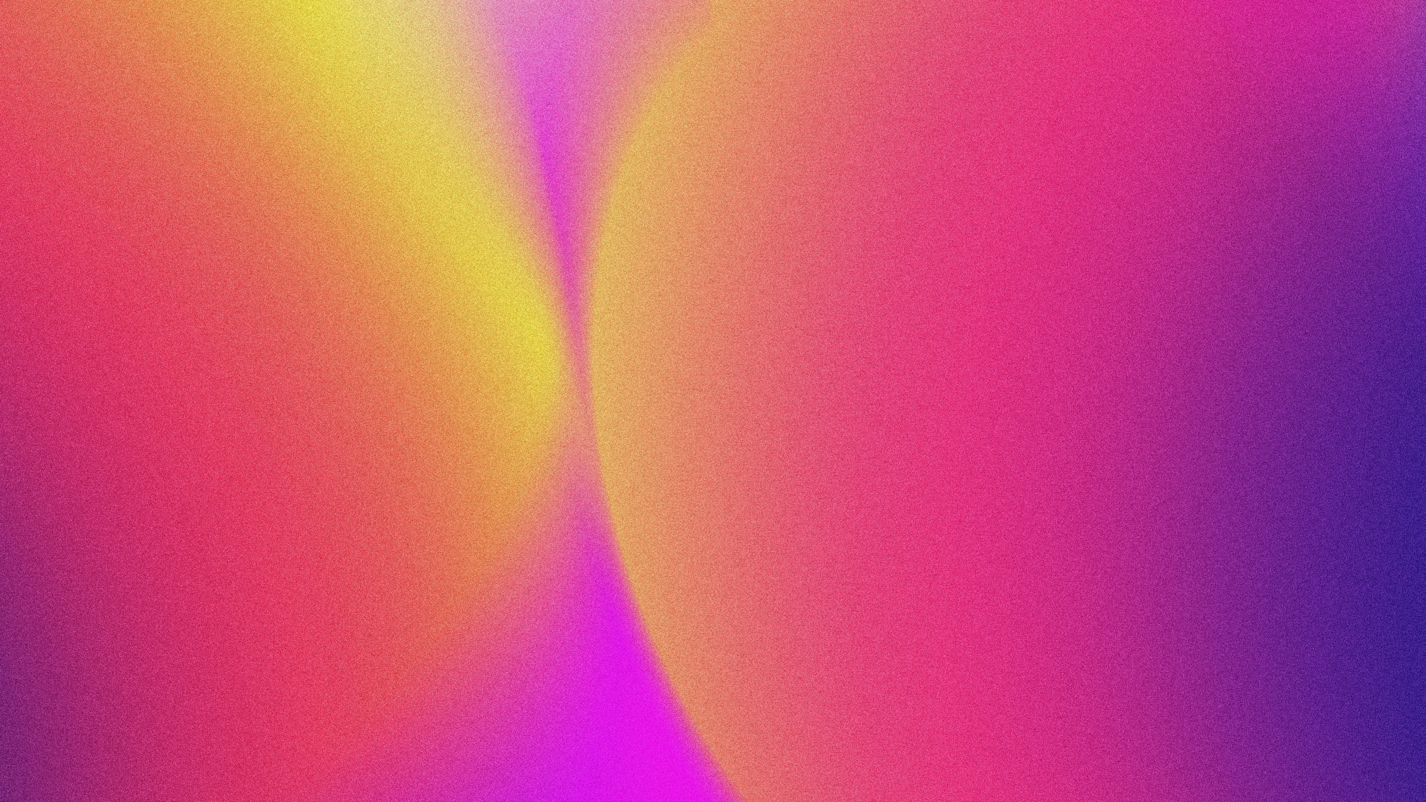 A soft gradient shifting from yellow to pink and purple with grainy texture