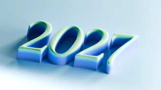 The number 2027 in three-dimensional blue and green gradient lettering on a light background