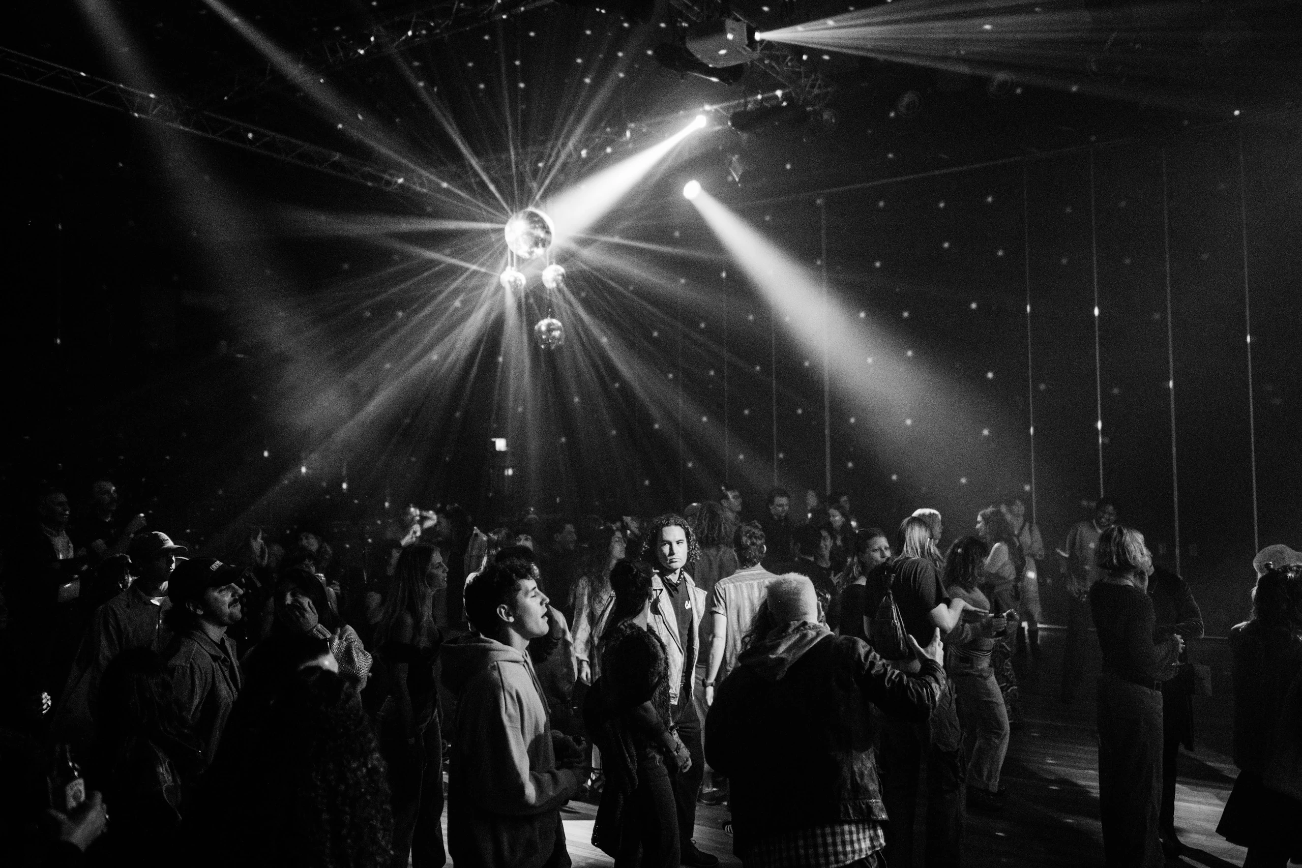 Black and white photo of a packed dance floor