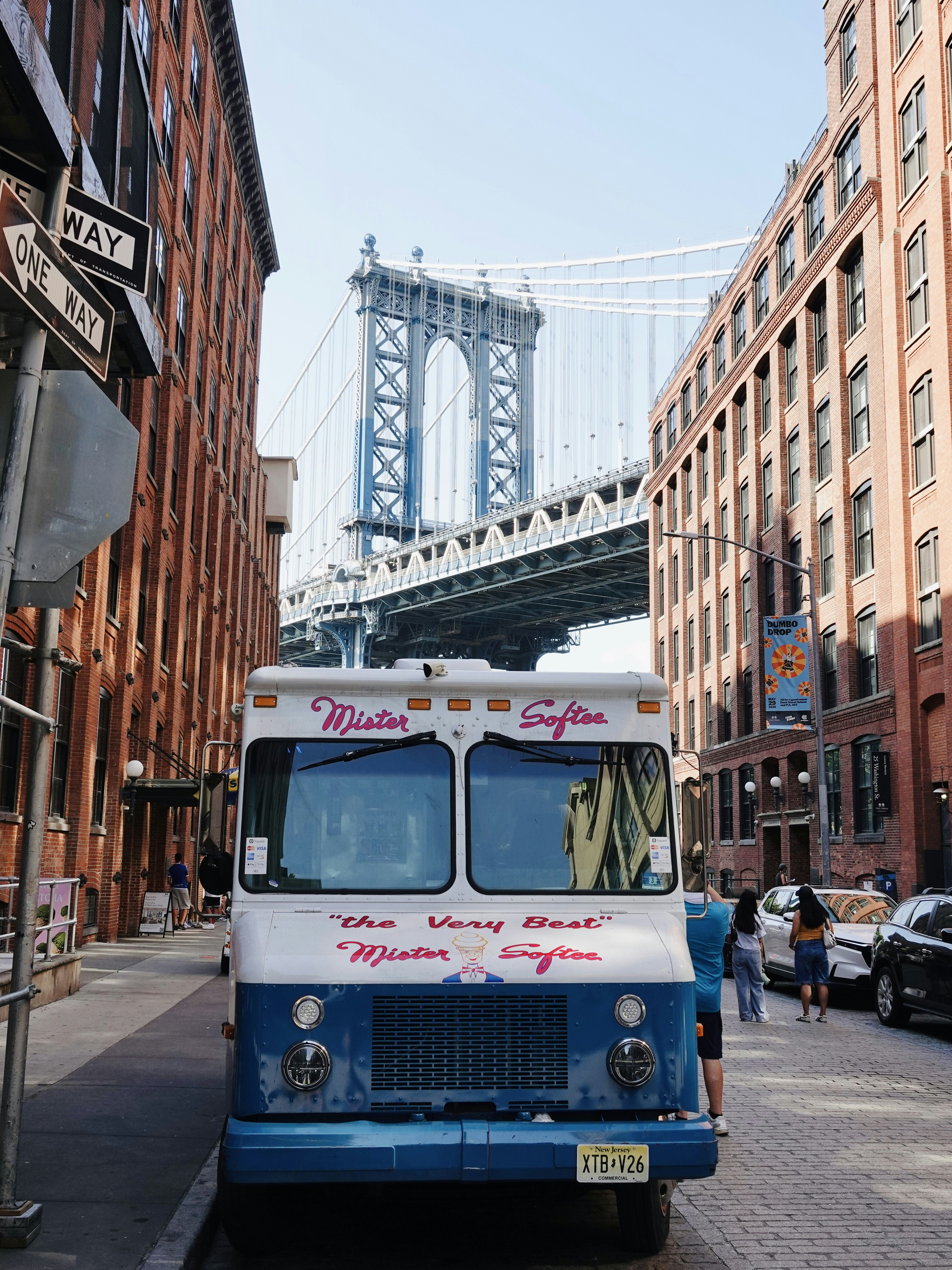 A Mister Softee ice cream truck on a cobblestone street in Brooklyn, New York