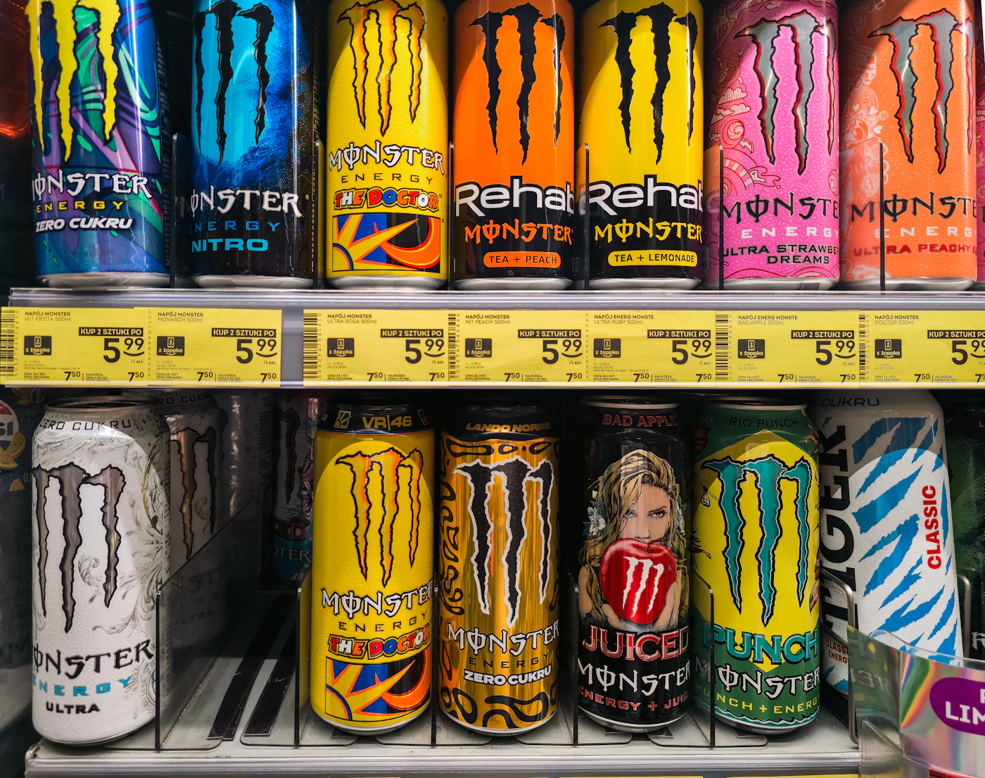 Rows of energy drink cans on shop shelves