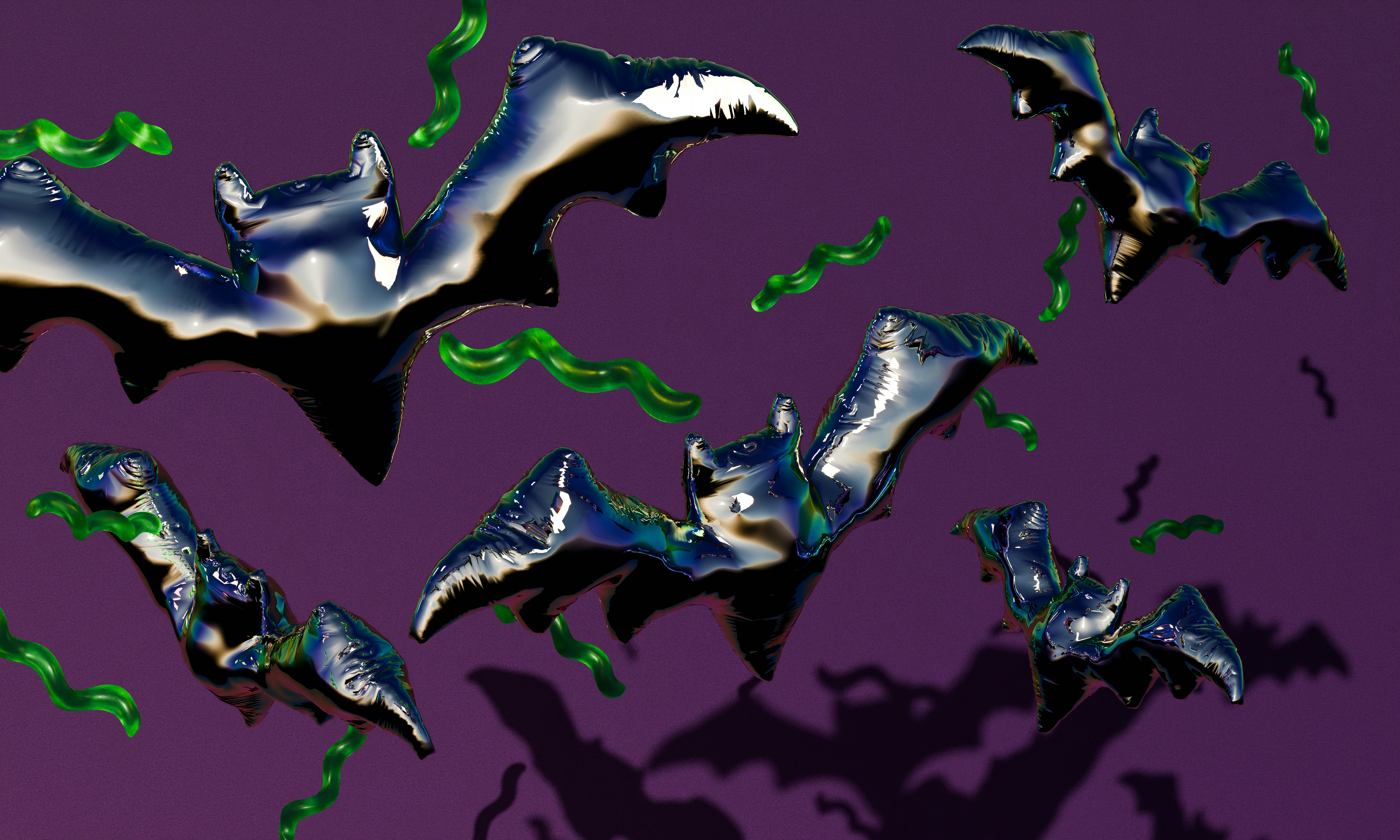 Shiny black bat balloons and green squiggly streamers against a dark purple background