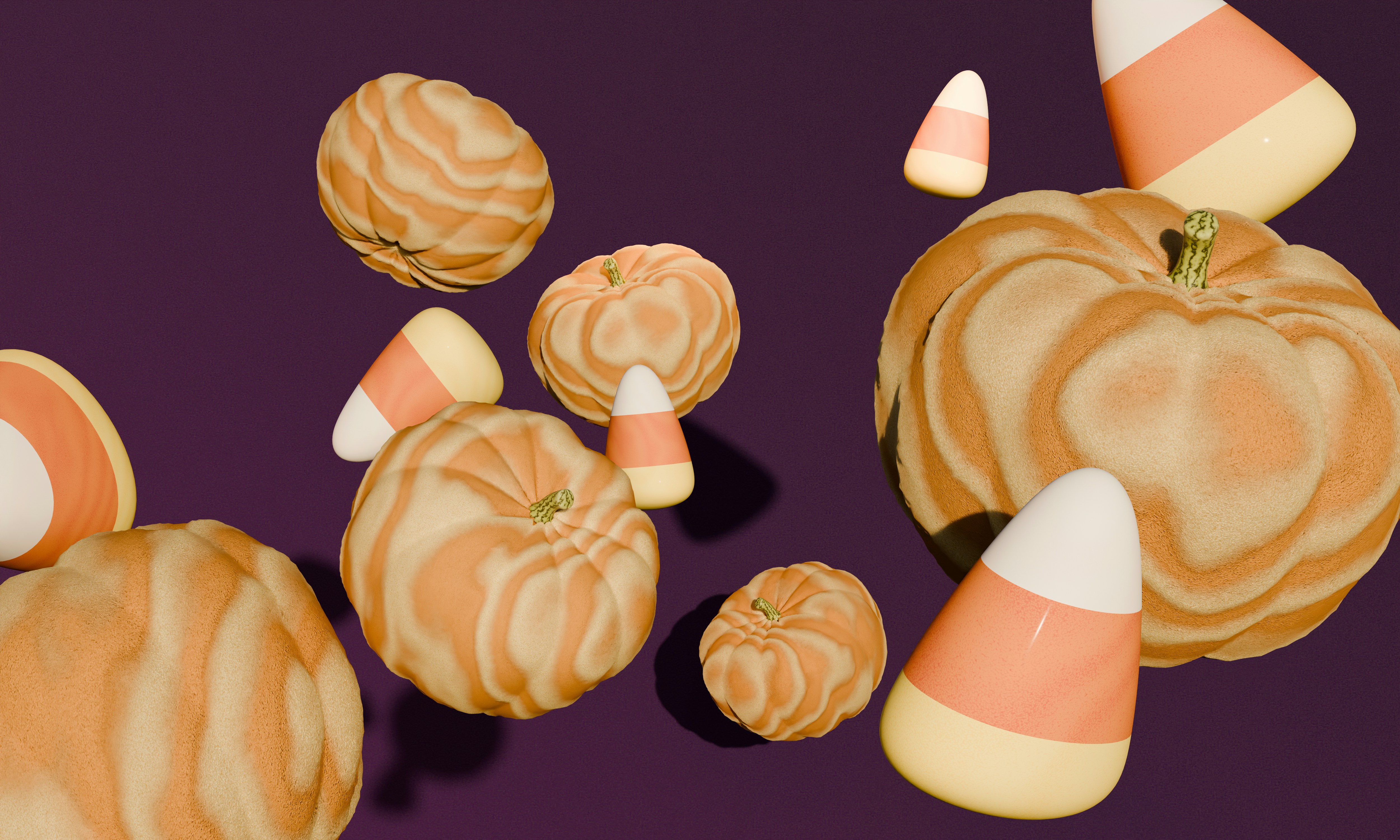 Floating pumpkins and candy corn pieces against a solid dark purple background