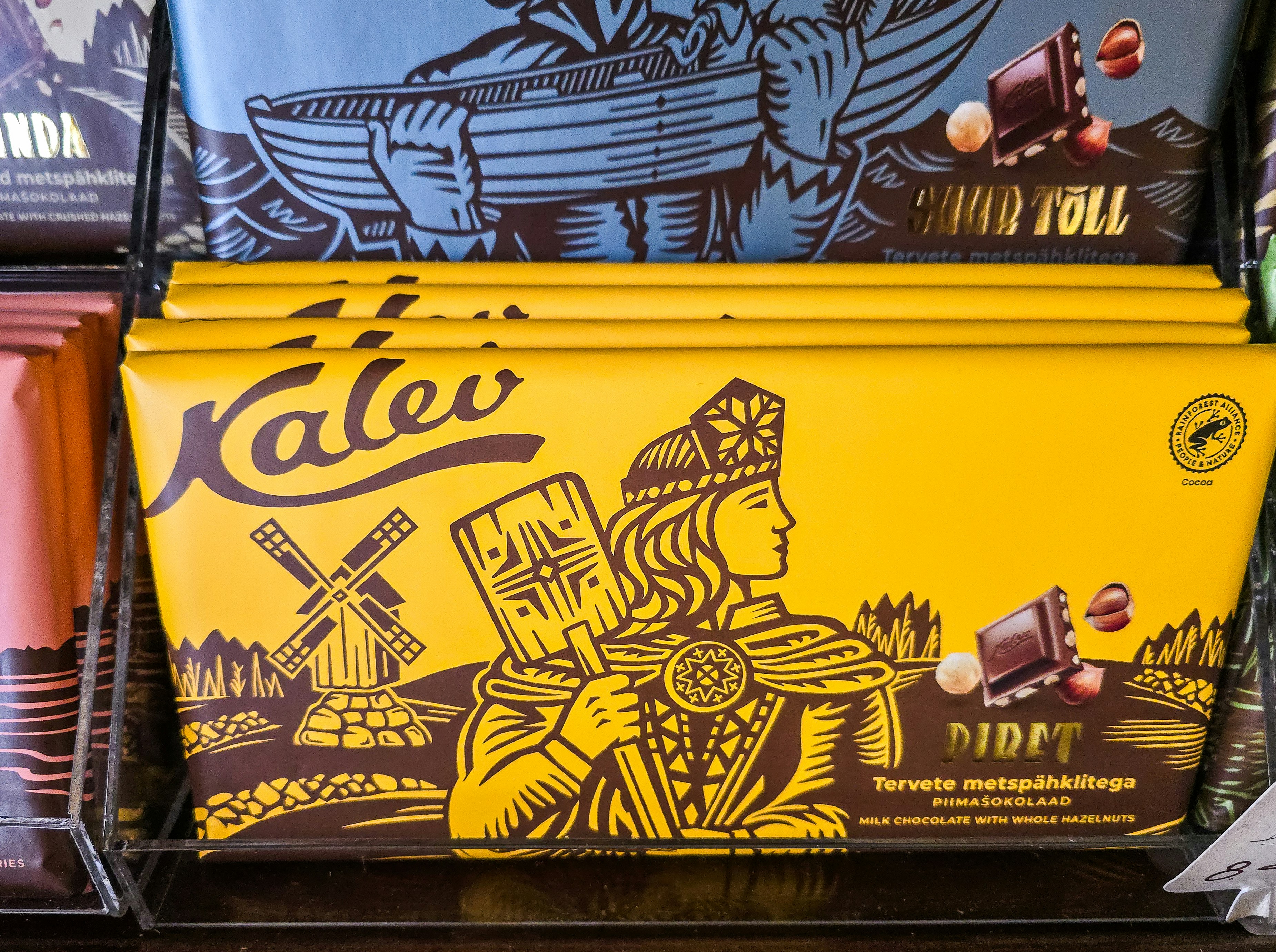 A yellow chocolate bar wrapper with a windmill and a person illustration