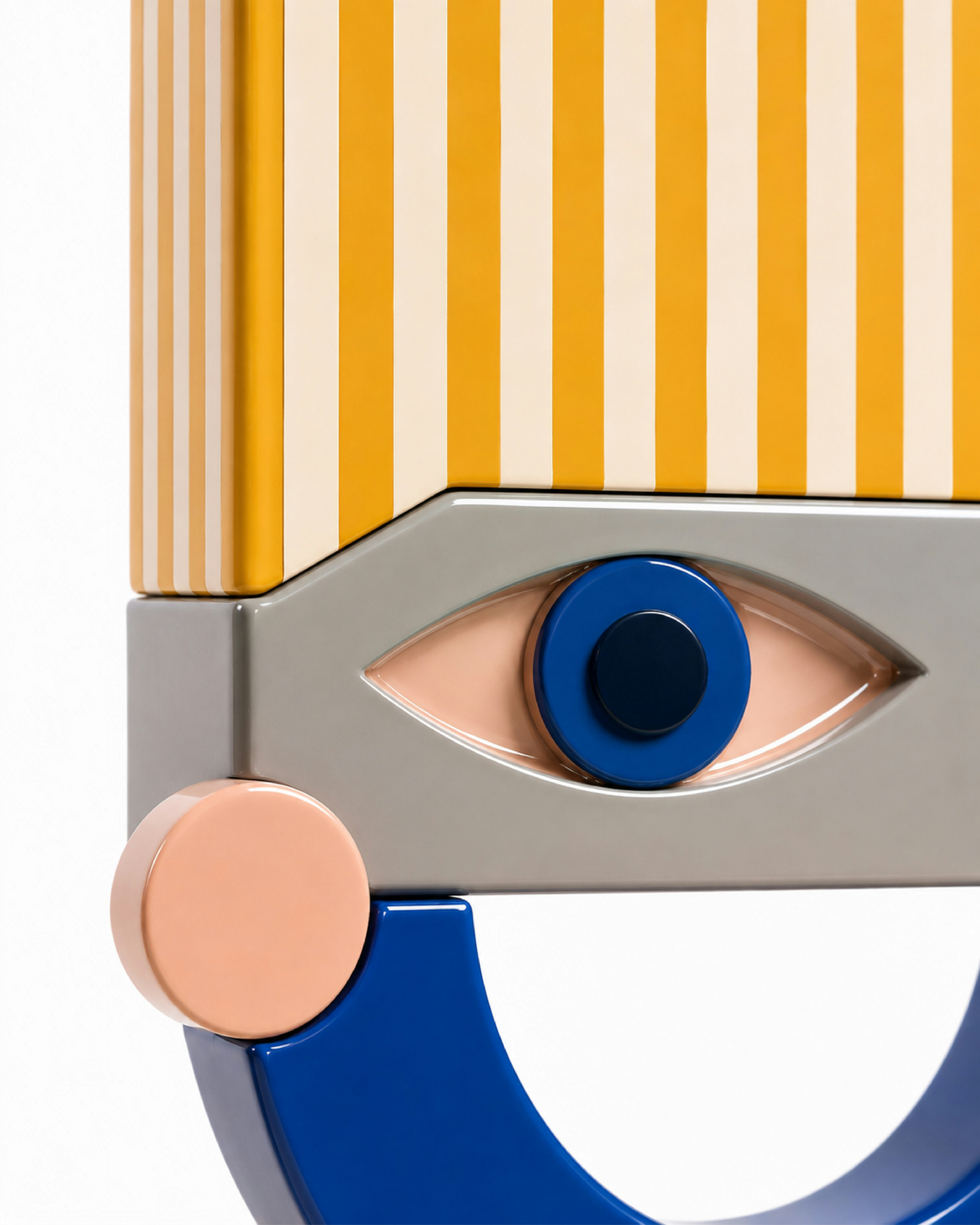 A stylized face sculpture with yellow stripes, a blue eye, and a pink cheek