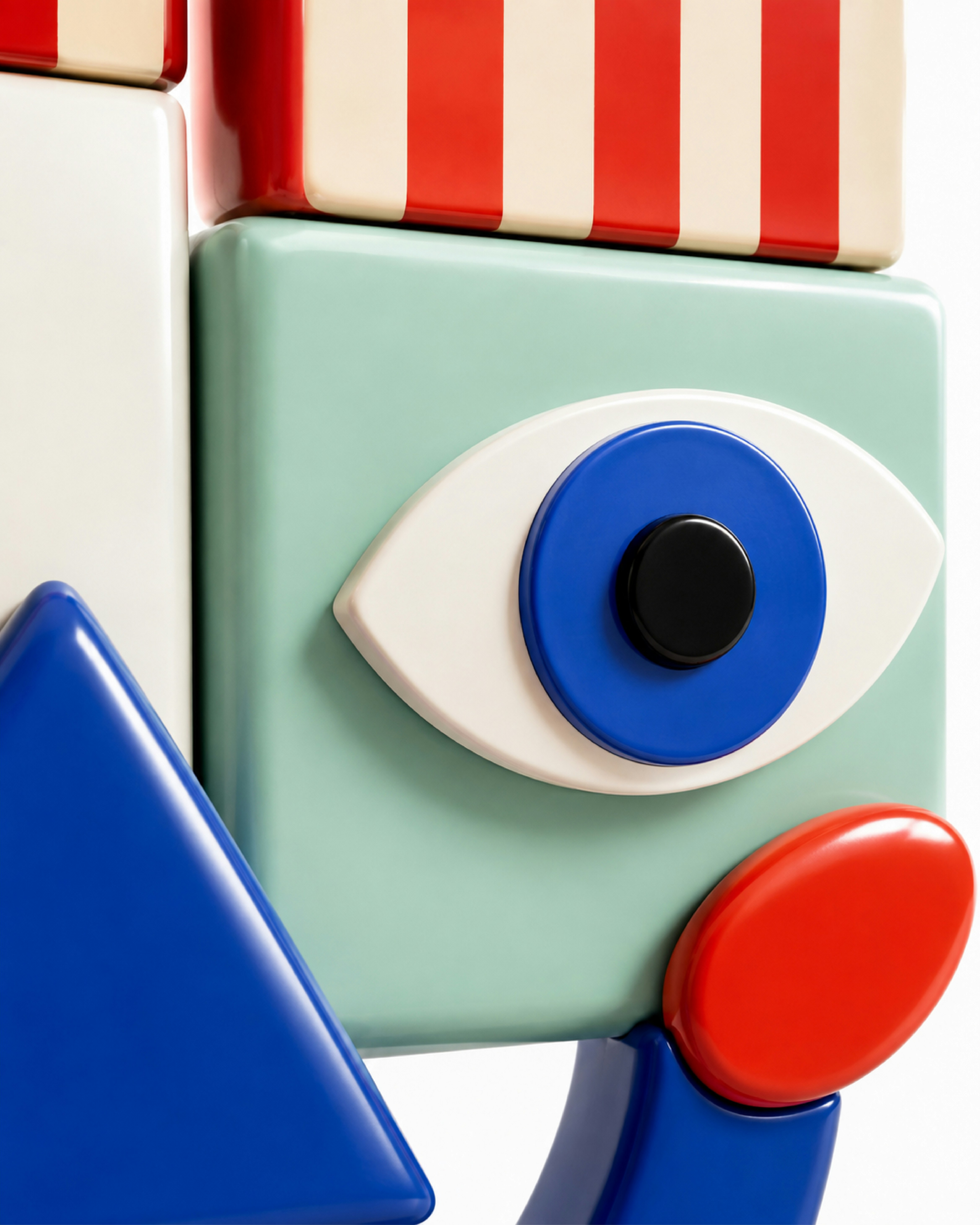 A stylized face made of colorful geometric plastic shapes on a white background