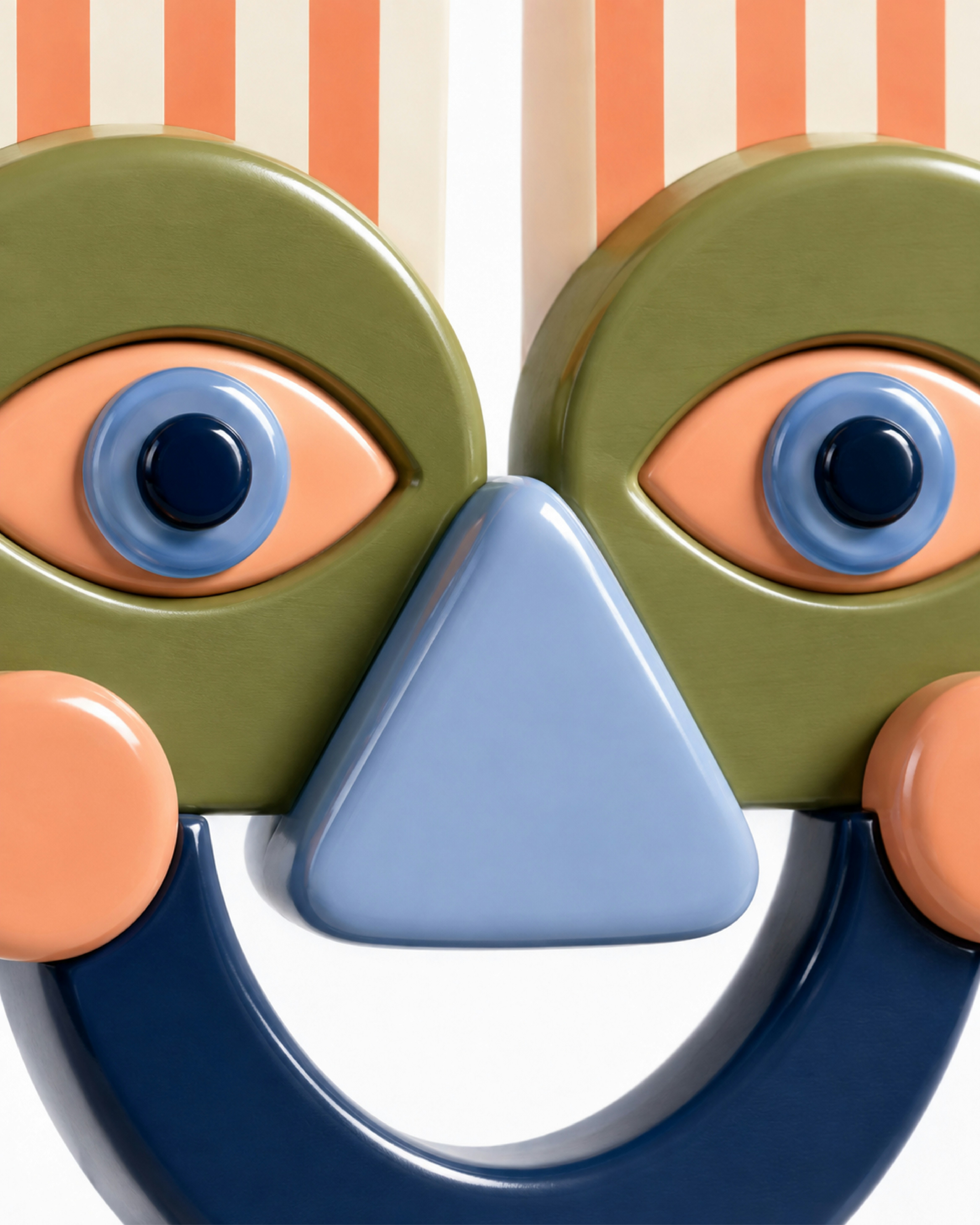 A stylized face sculpture with olive green eyes and a blue triangular nose