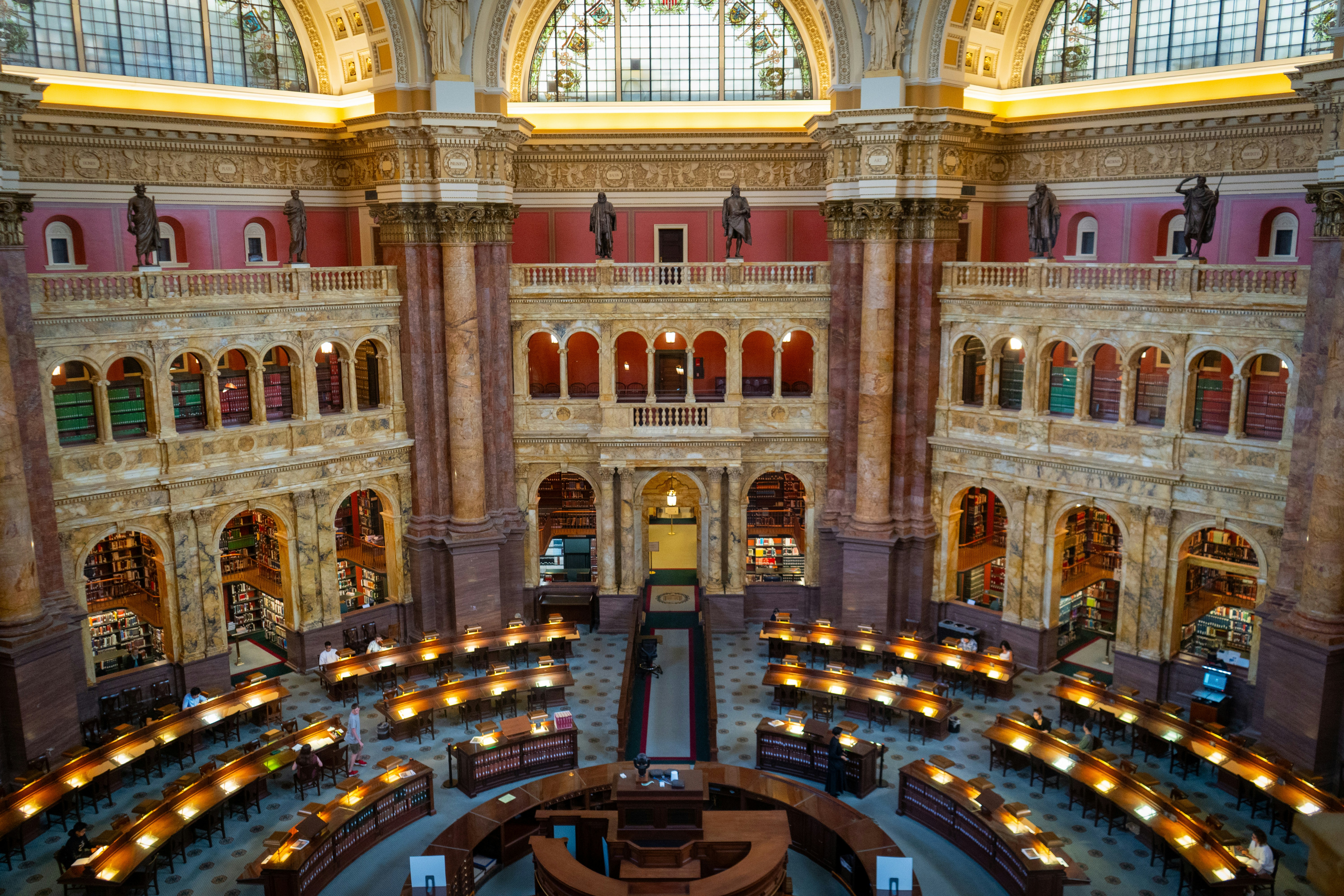 The Library of Congress Main Reading Room with ornate marble columns and arched bookshelves