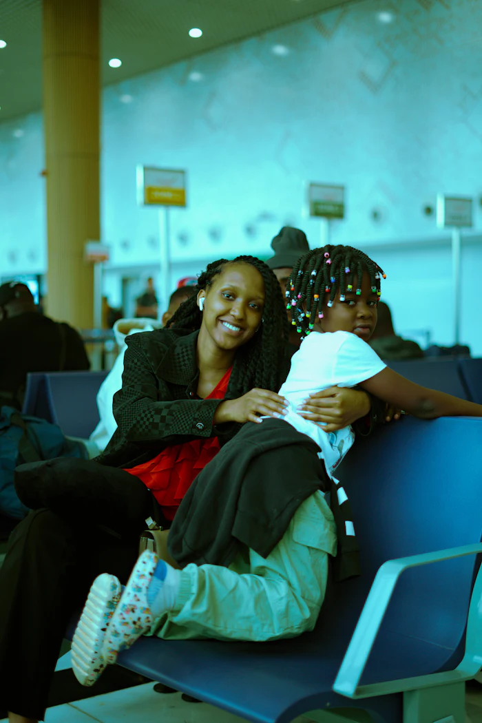 Mother and child waiting together in an airport terminal