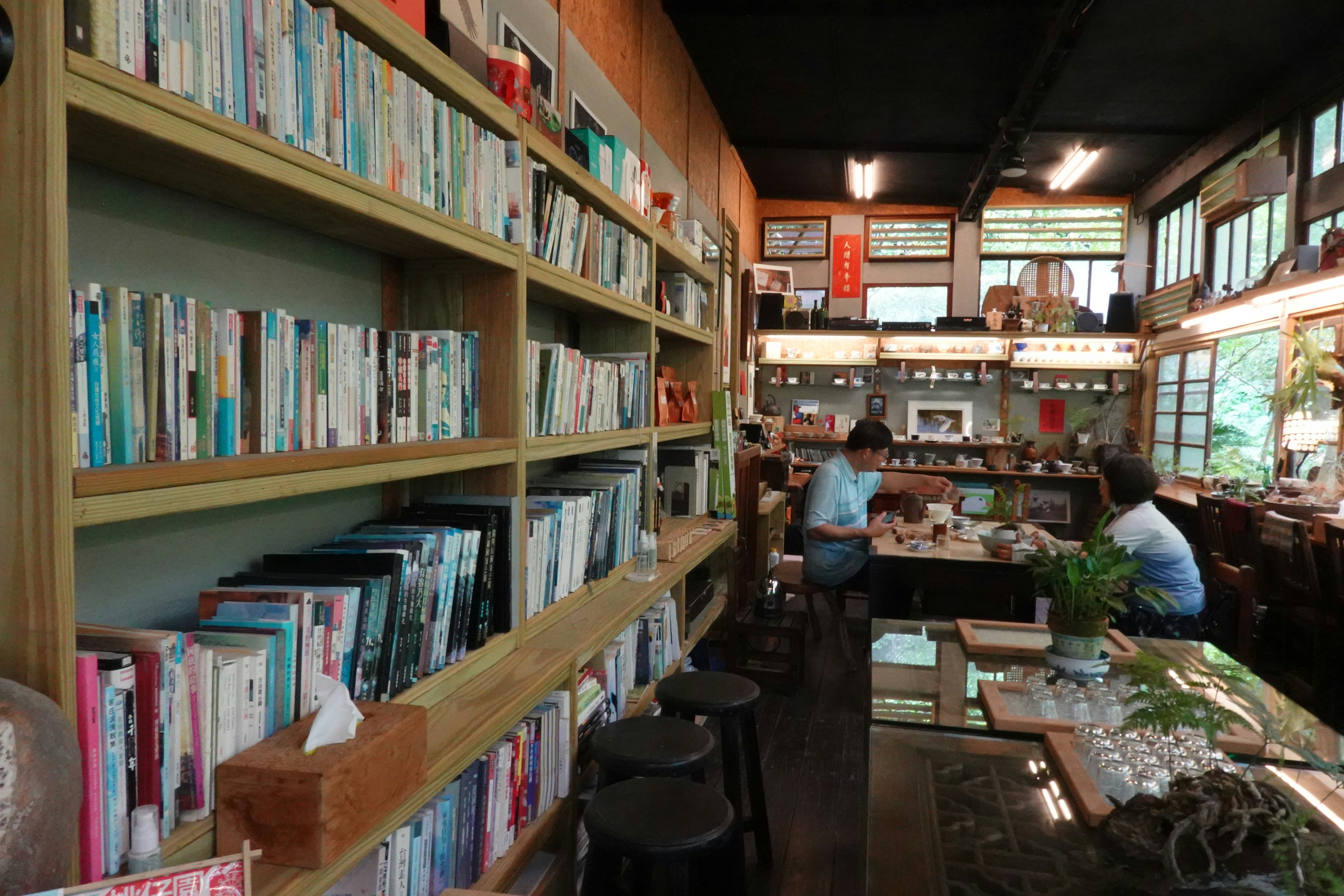 Two people at a table in a bookshop cafe