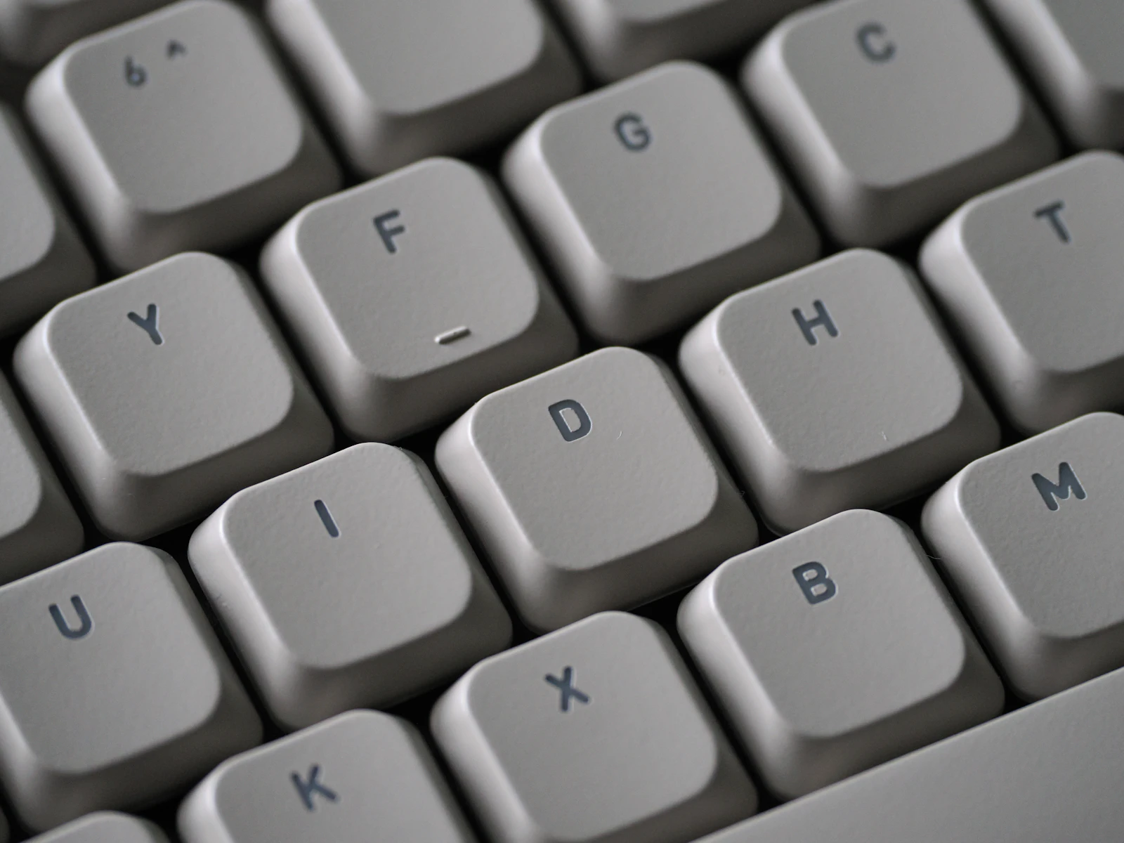 Close-up of mechanical keyboard switches showing the plastic housings and metal contacts that distinguish each switch type