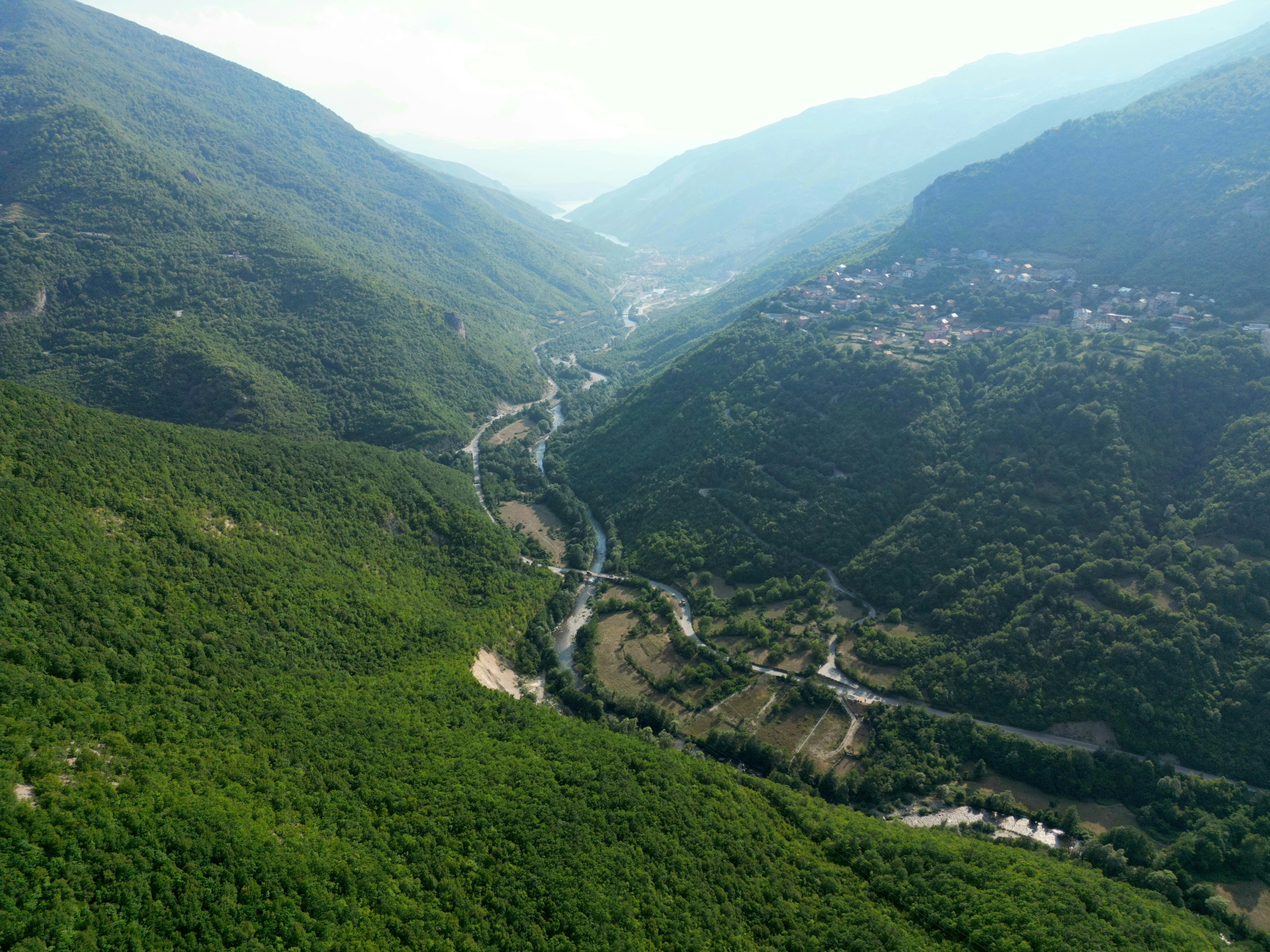 Winding river in green mountain valley - Free Photo on Unsplash