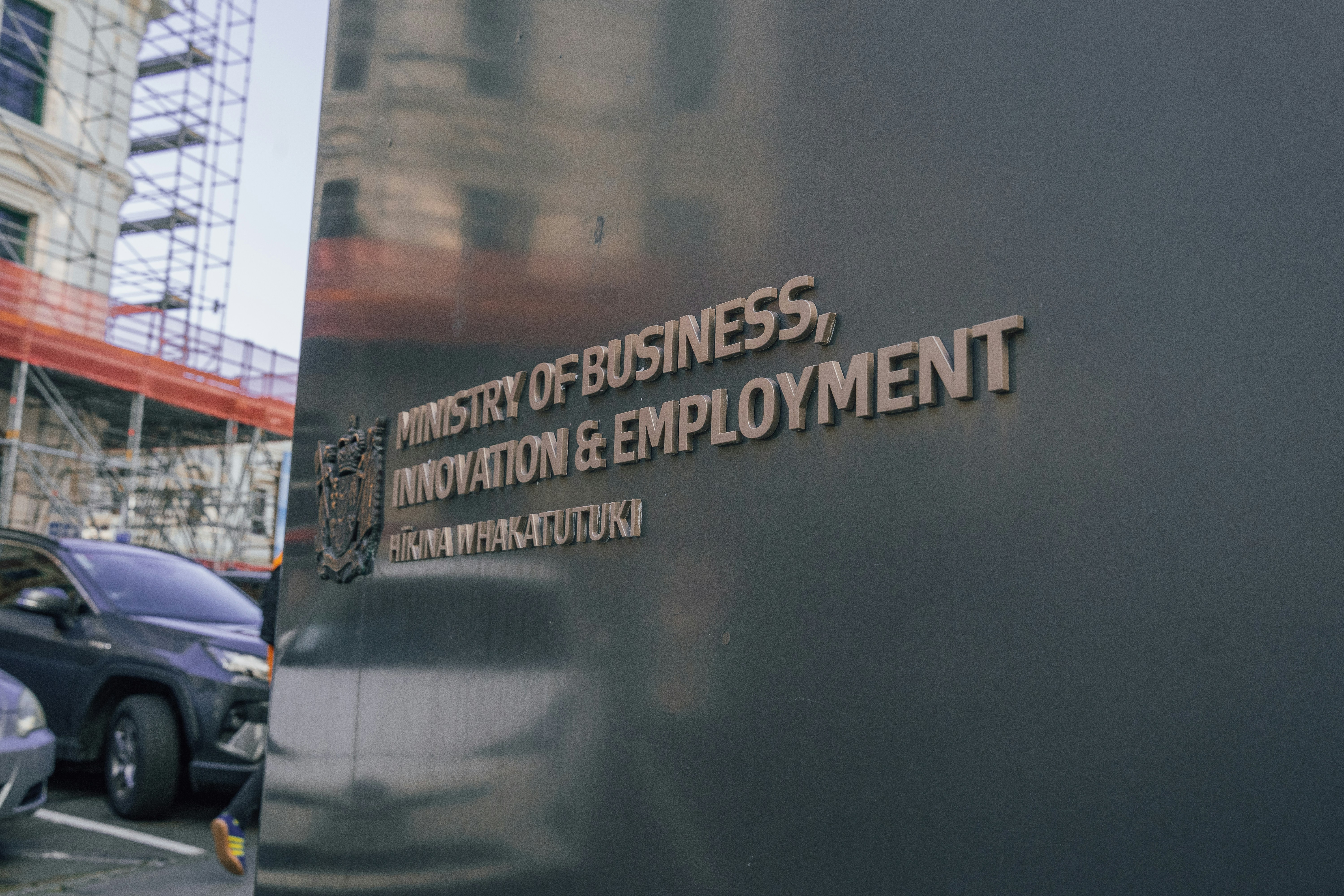 Street-side view of Ministry of Business, Innovation and Employment signage in Wellington, New Zealand.