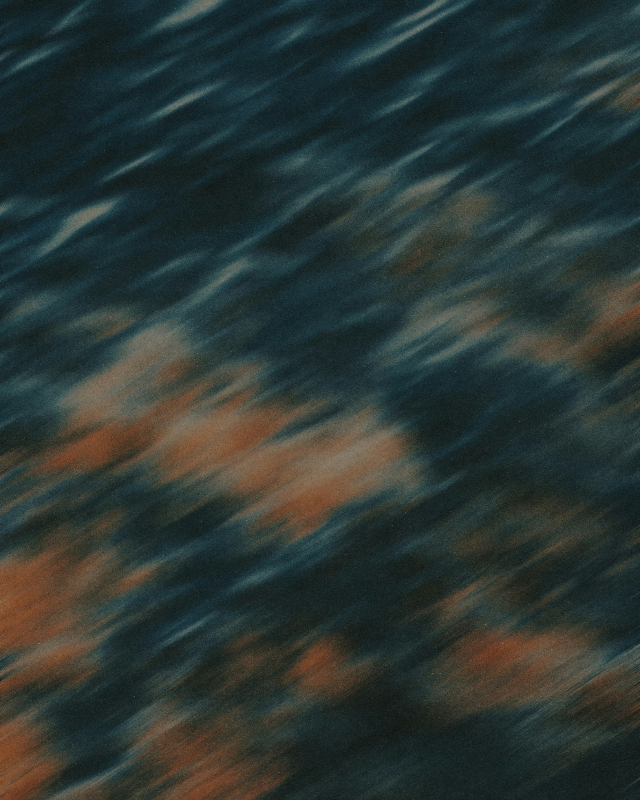 Abstract motion blur with diagonal streaks of dark blue and burnt orange