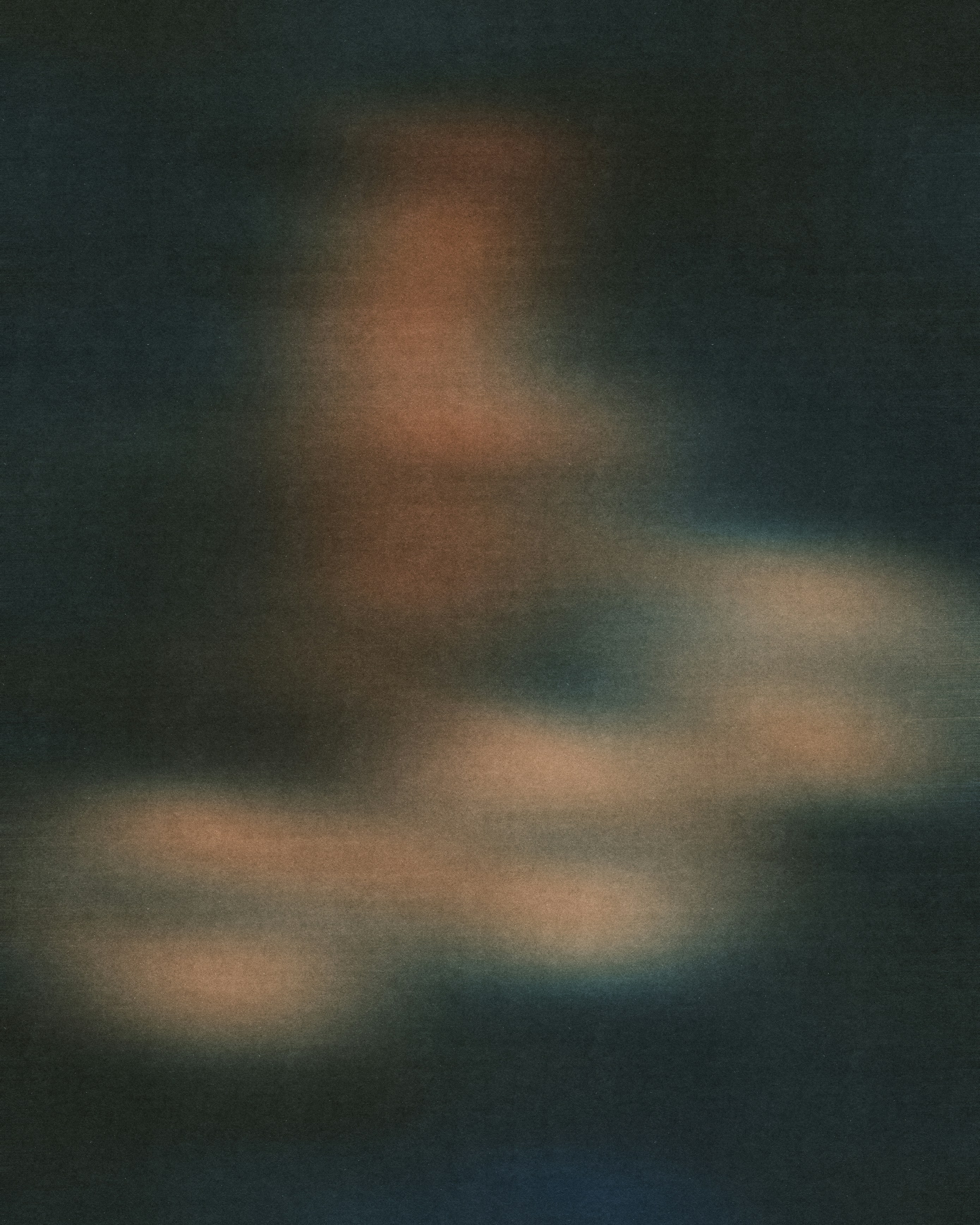 Abstract blurred shapes in muted orange and dark blue tones