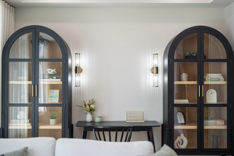 Styled interior design vignette with a small floral arrangement on a console table