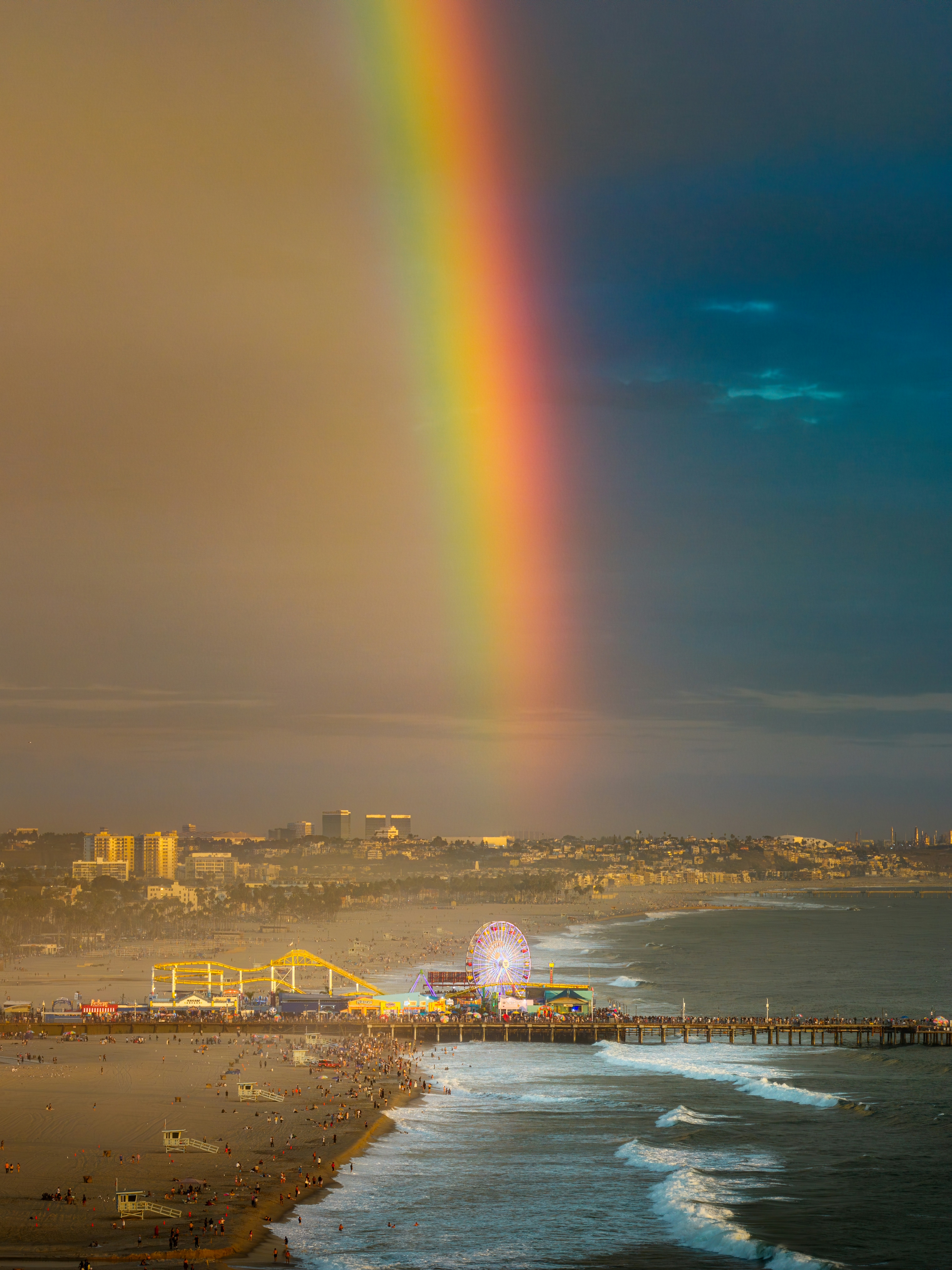 A vibrant rainbow over the Santa Monica Pier and beach in Santa Monica