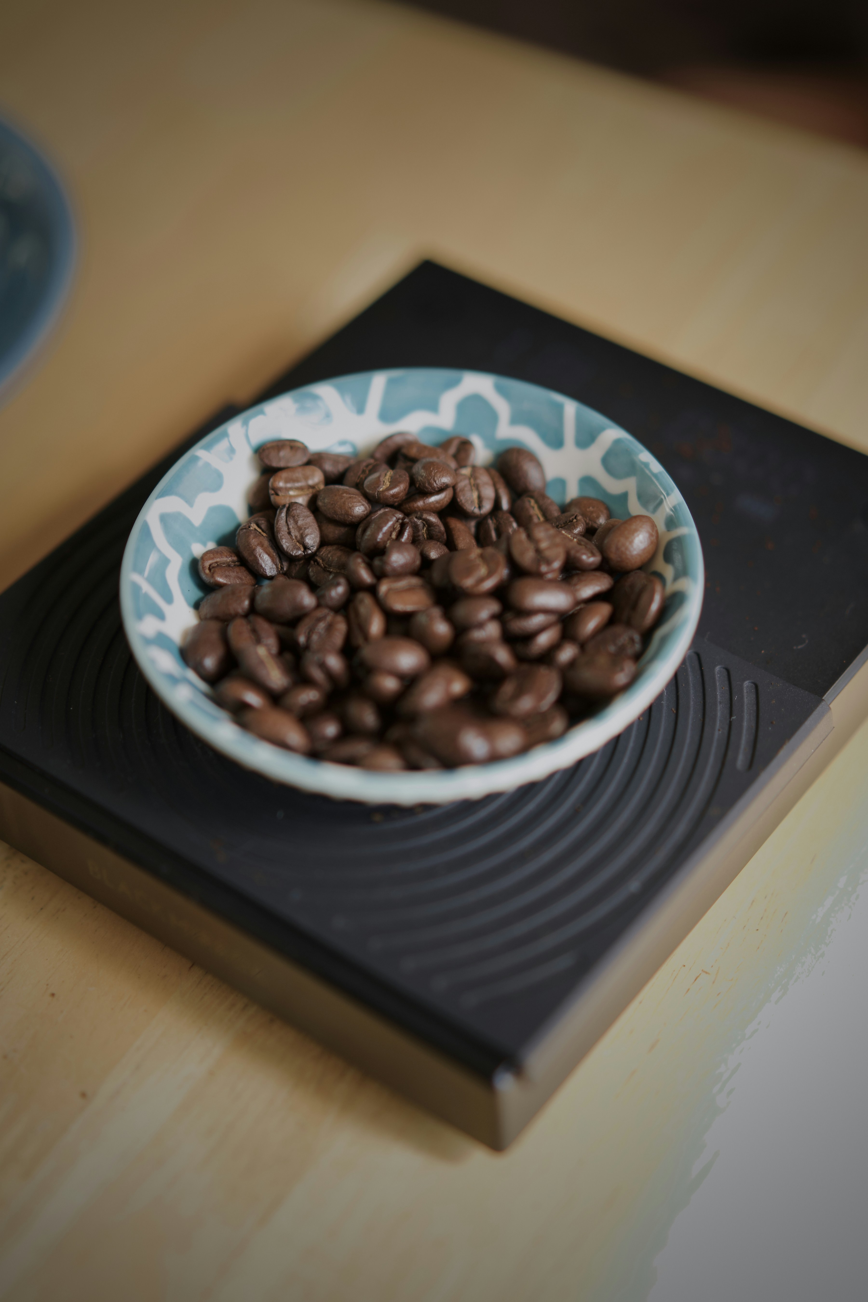 Roasted coffee beans arranged for making espresso at home.
