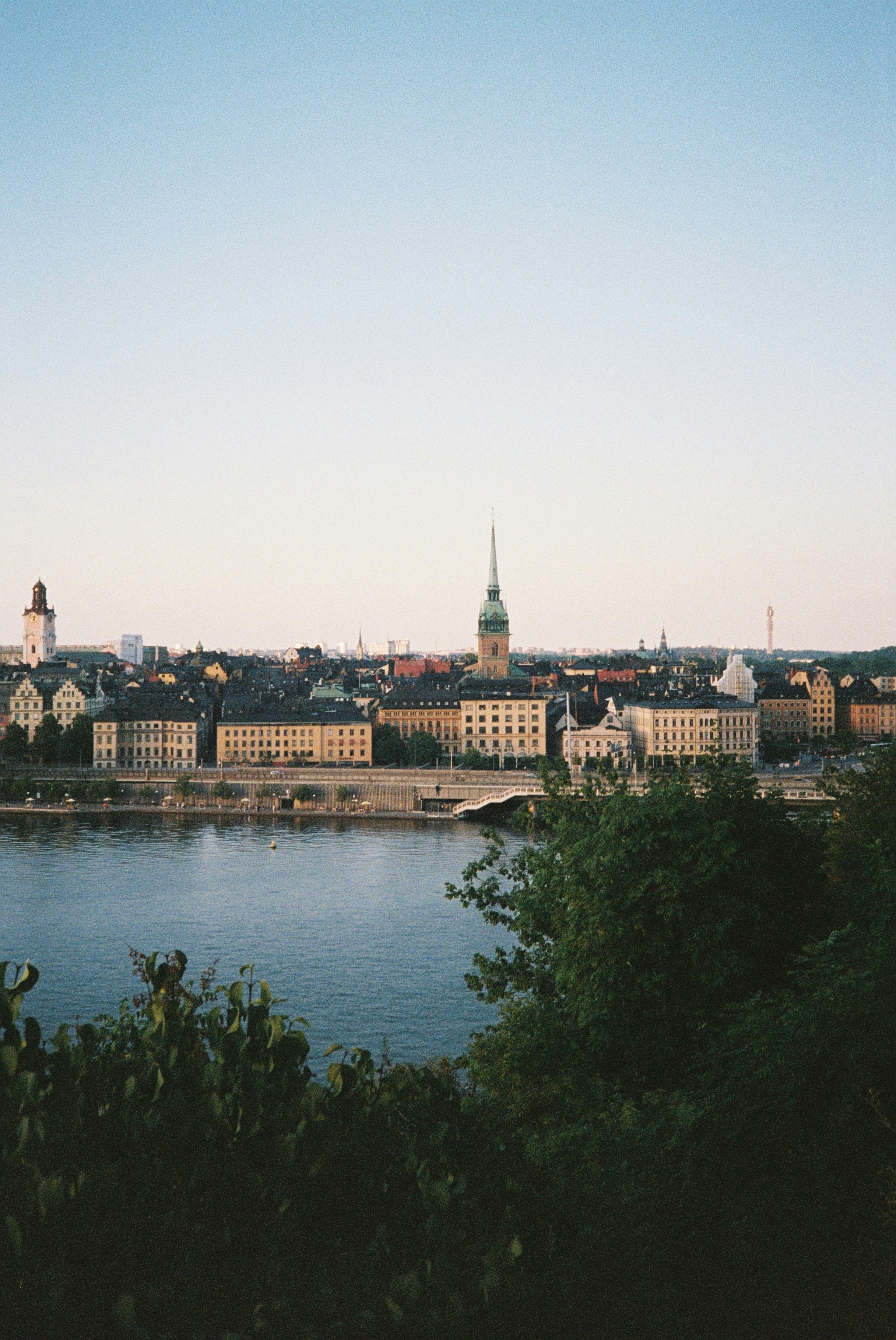 The Stockholm skyline across the water with historic buildings and a church spire