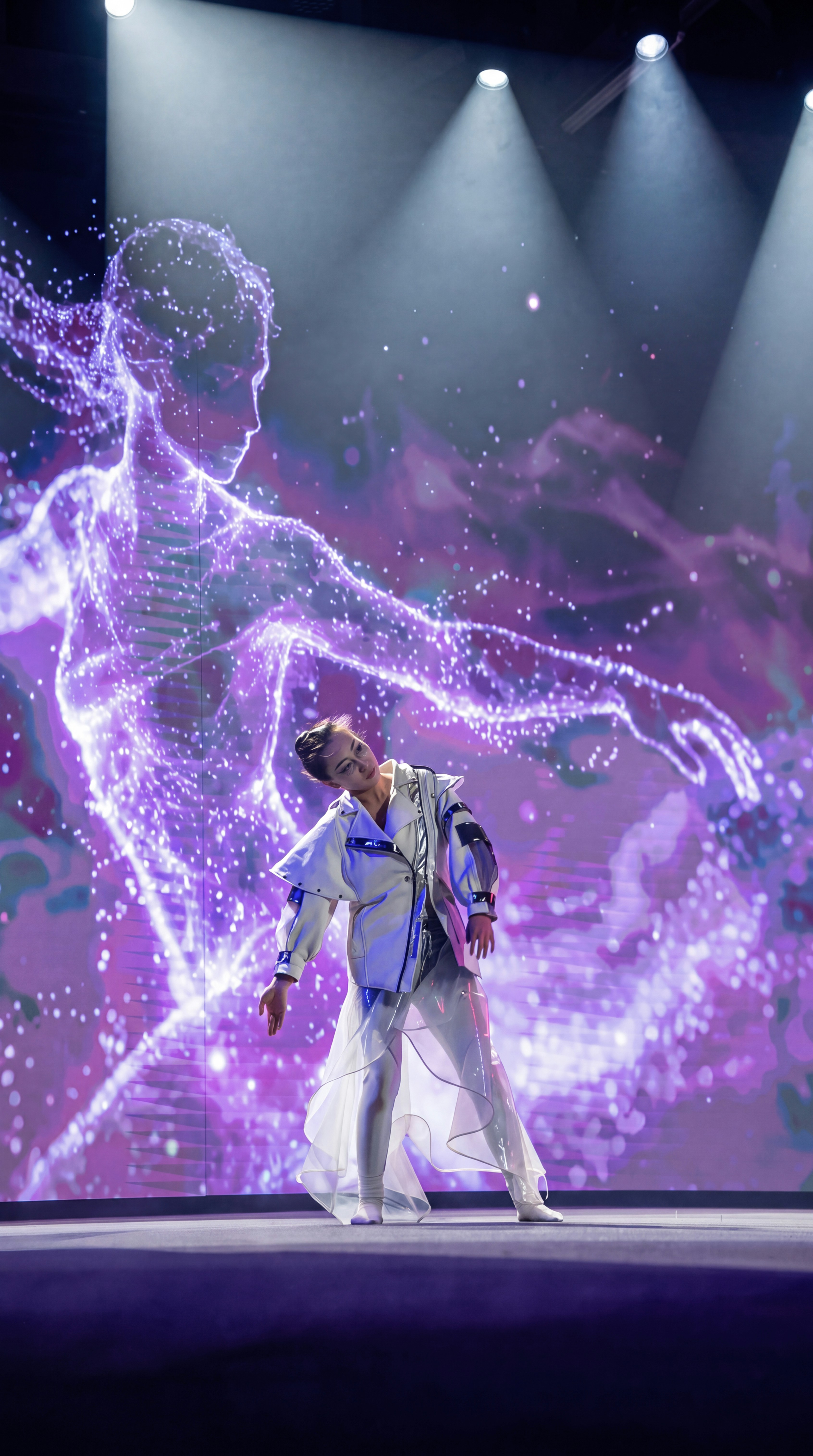 A dancer traced in coloured light