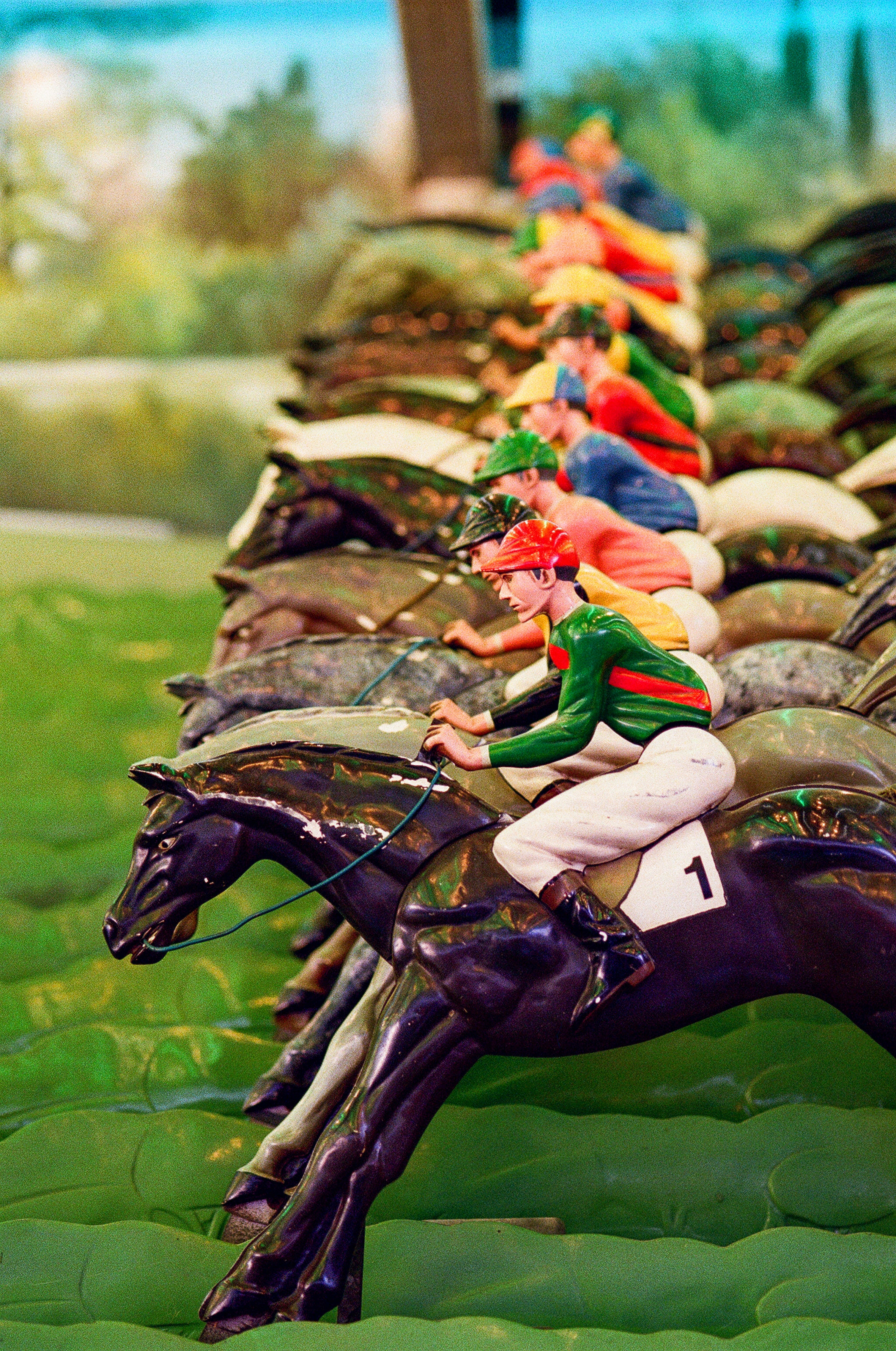 Colorful racing silks and saddle cloths