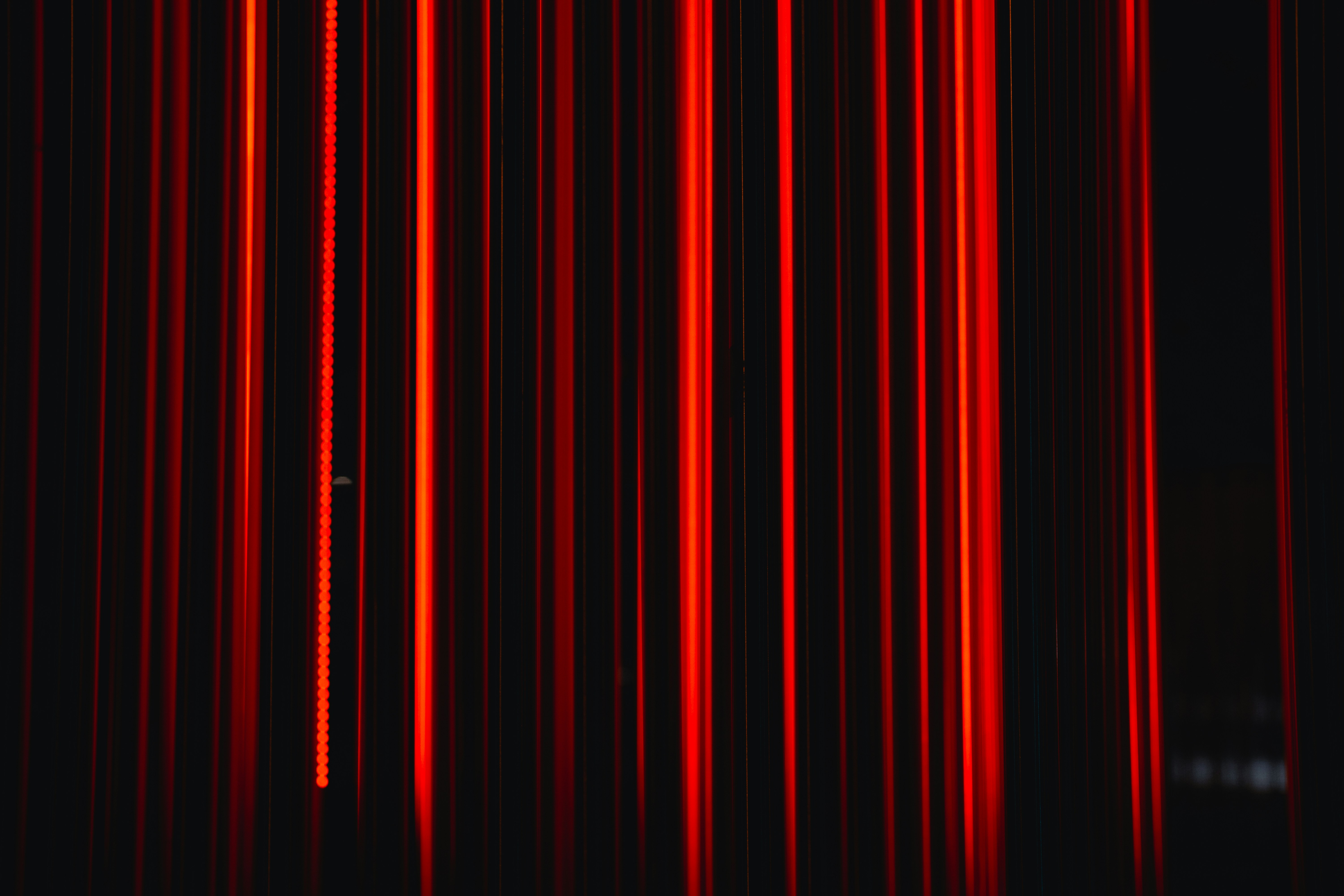 Vertical red light streaks - Free Photo on Unsplash