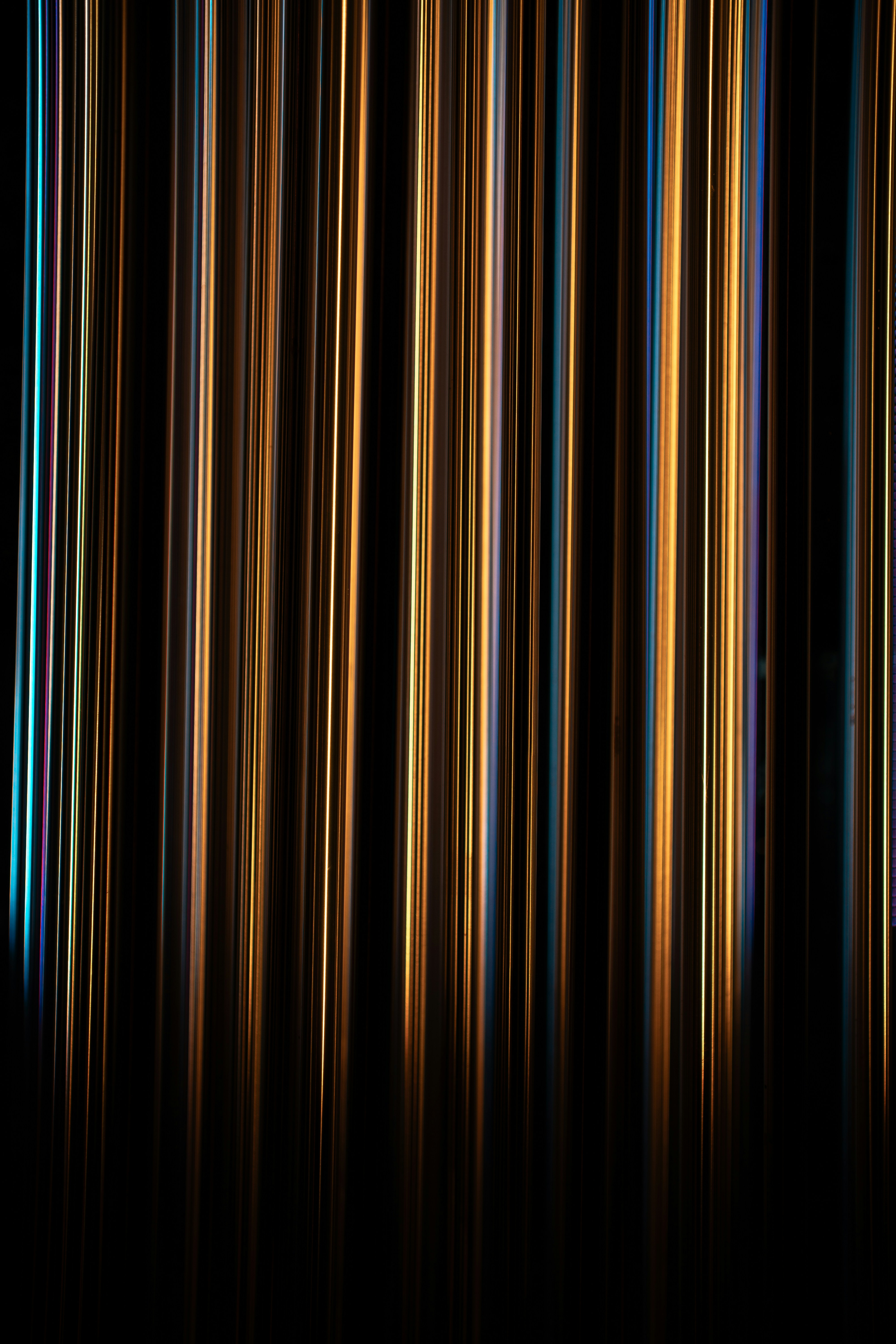 Vertical orange and blue light streaks - Free Photo on Unsplash